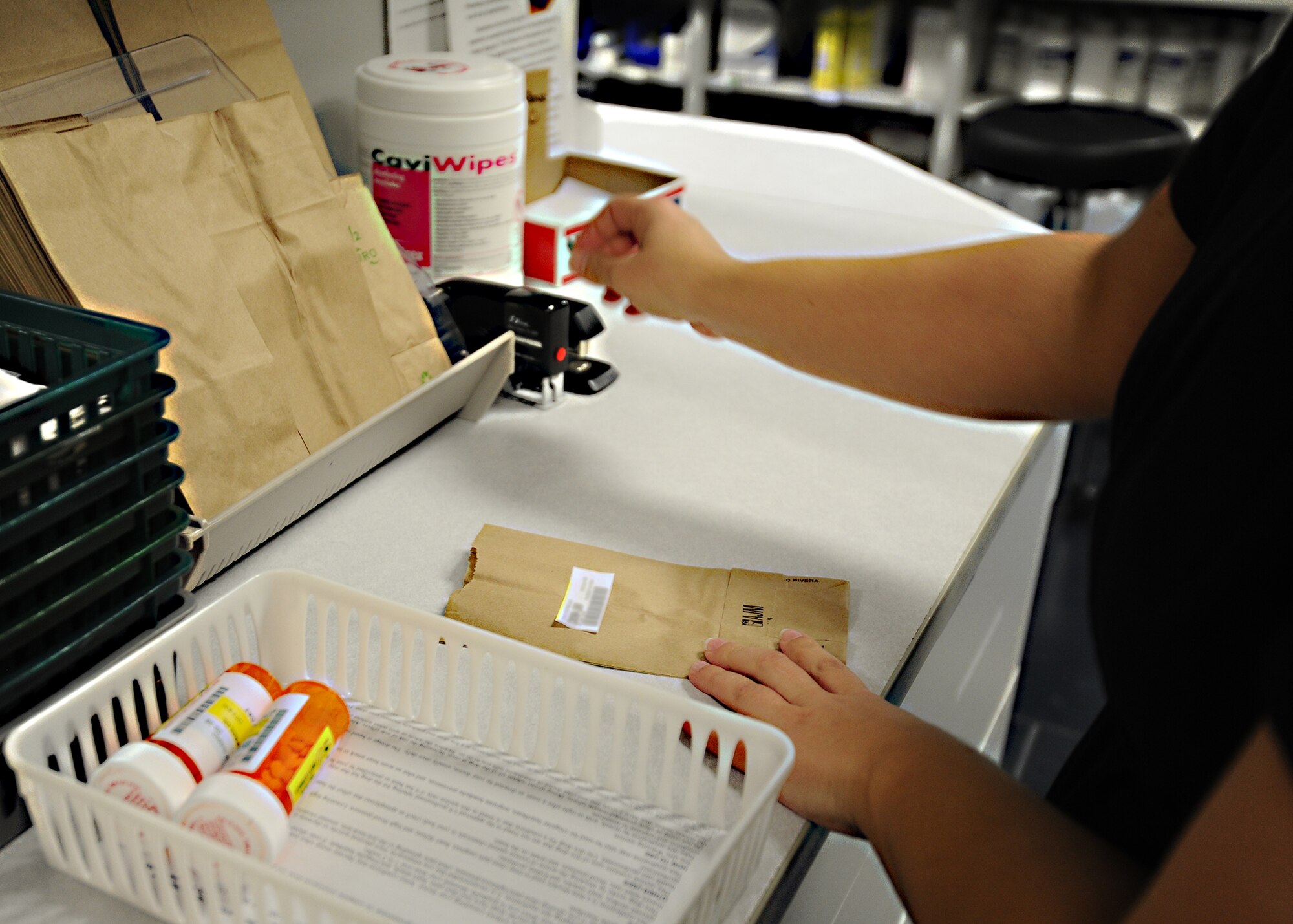 Stephanie Schreiner, 325th Medical Support Squadron pharmacy technician, labels and prepares a prescription at the 325th Medical Group pharmacy Jan. 7. The pharmacy on average dispenses 460 units of pharmaceuticals per and 216,000 per year. The pharmacy's satellite pharmacy serves as an alternative for customer convenience and is located at the Tyndall Base Exchange. (U.S. Air Force photo by Senior Airman Ty-Rico Lea/Released)