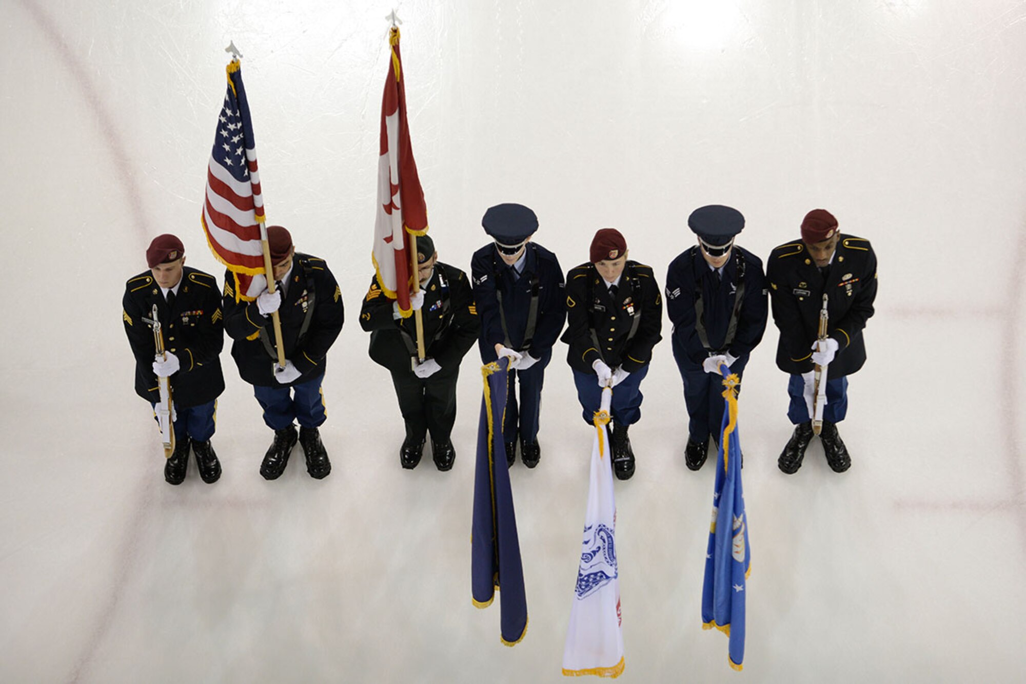 Members of the Joint Base Elmendorf-Richardson honor guard present the colors during the JBER Army vs. Air Force game at the Sullivan Arena in Anchorage, Alaska, Jan. 9, 2016. The game promoted esprit de corps and was intended to enhance the relationship between JBER and the Anchorage community. (U.S. Air Force photo by Airman Valerie Monroy)