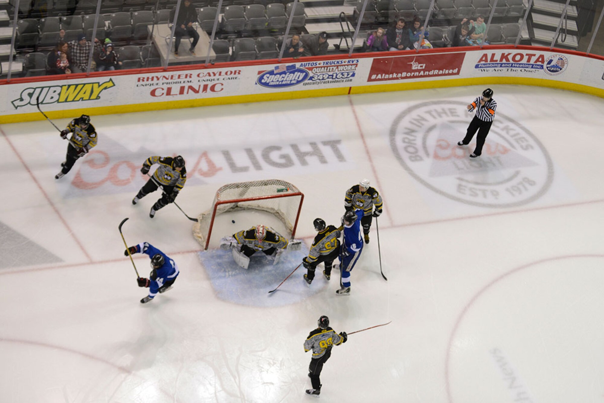 The Air Force team scores their first goal against the Army at the third annual Joint Base Elmendorf-Richardson Army vs. Air Force hockey game. The game promoted esprit de corps and was intended to enhance the relationship between JBER and the Anchorage community. (U.S. Air Force photo by Airman Valerie Monroy)