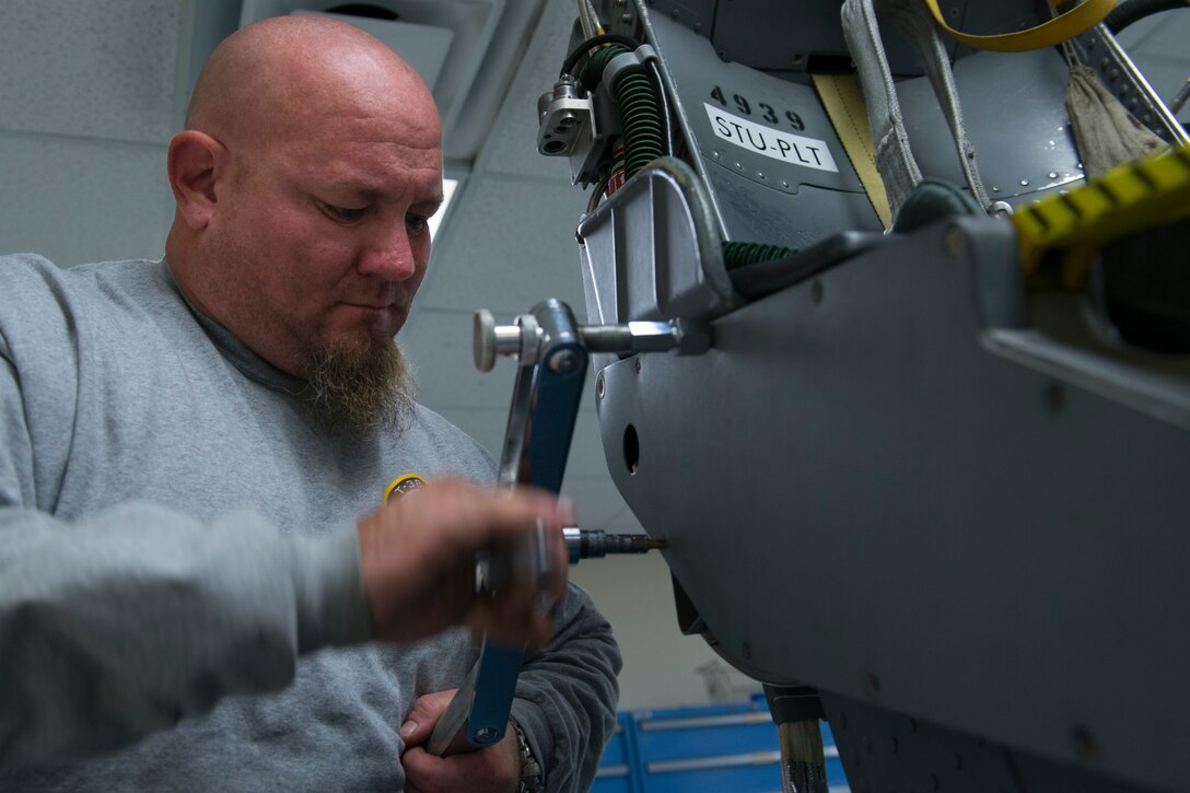 Jason Clem, an aircraft mechanic from M1 Support Services, uses a “Johnson-bar” to remove a screw from a T-38 Talon seat at Langley Air Force Base, Va., Jan. 8, 2016. Clem has worked on egress systems for the F-15 Eagle, F-16 Falcon, F-22 Raptor, A-10 Thunderbolt II and T-38 Talon.(U.S. Air Force photo by Staff Sgt. J.D. Strong II)
