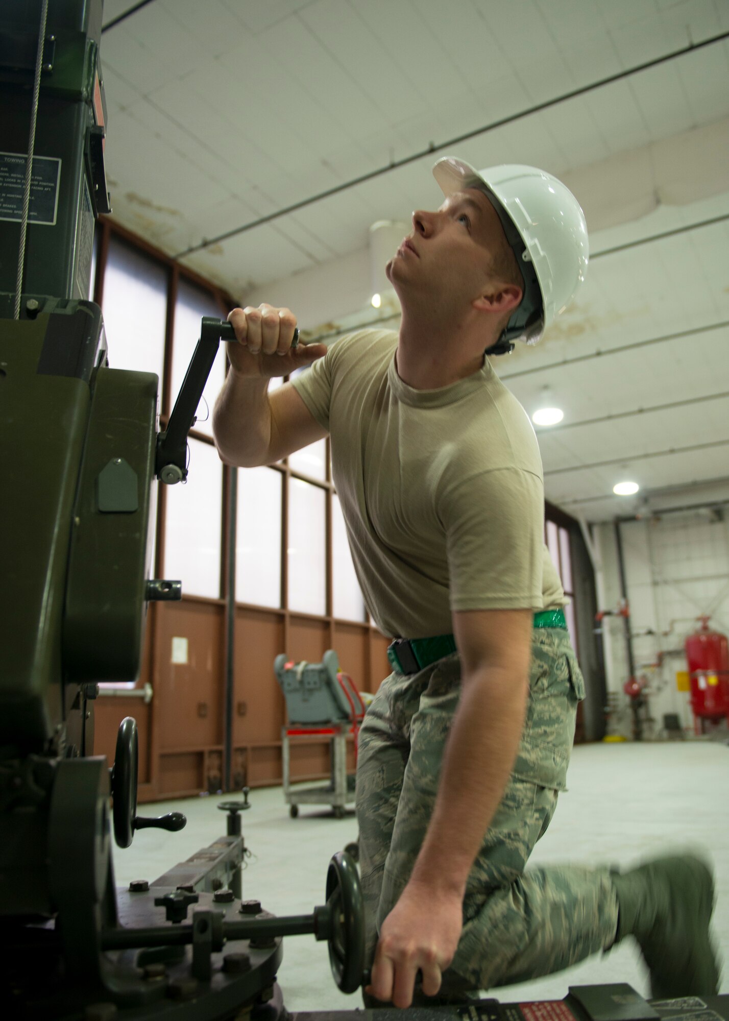 U.S. Air Force Airman 1st Class Eric Hedgepeth, egress systems journeyman assigned to the 1st Maintenance Squadron, uses an east-west crane to remove a T-38 Talon seat at Langley Air Force Base, Va., Jan. 8, 2016. Hedgepeth has served as an egress systems technician for two years. (U.S. Air Force photo by Staff Sgt. J.D. Strong II)