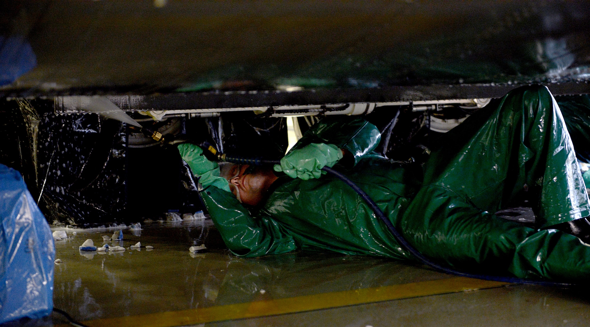 Senior Airman Kyle Warnock, 86th Maintenance Squadron crew chief, sprays the underbelly of a C-130J Super Hercules during an aircraft wash Jan. 4, 2016, at Ramstein Air Base, Germany. The wash was performed before the aircraft’s C-2 isochronal (ISO) inspection. This examination marks the 14th and final C-2 ISO inspection for the 86th Airlift Wing until 2020. (U.S. Air Force photo/Staff Sgt. Timothy Moore) (U.S. Air Force photo/Staff Sgt. Timothy Moore)