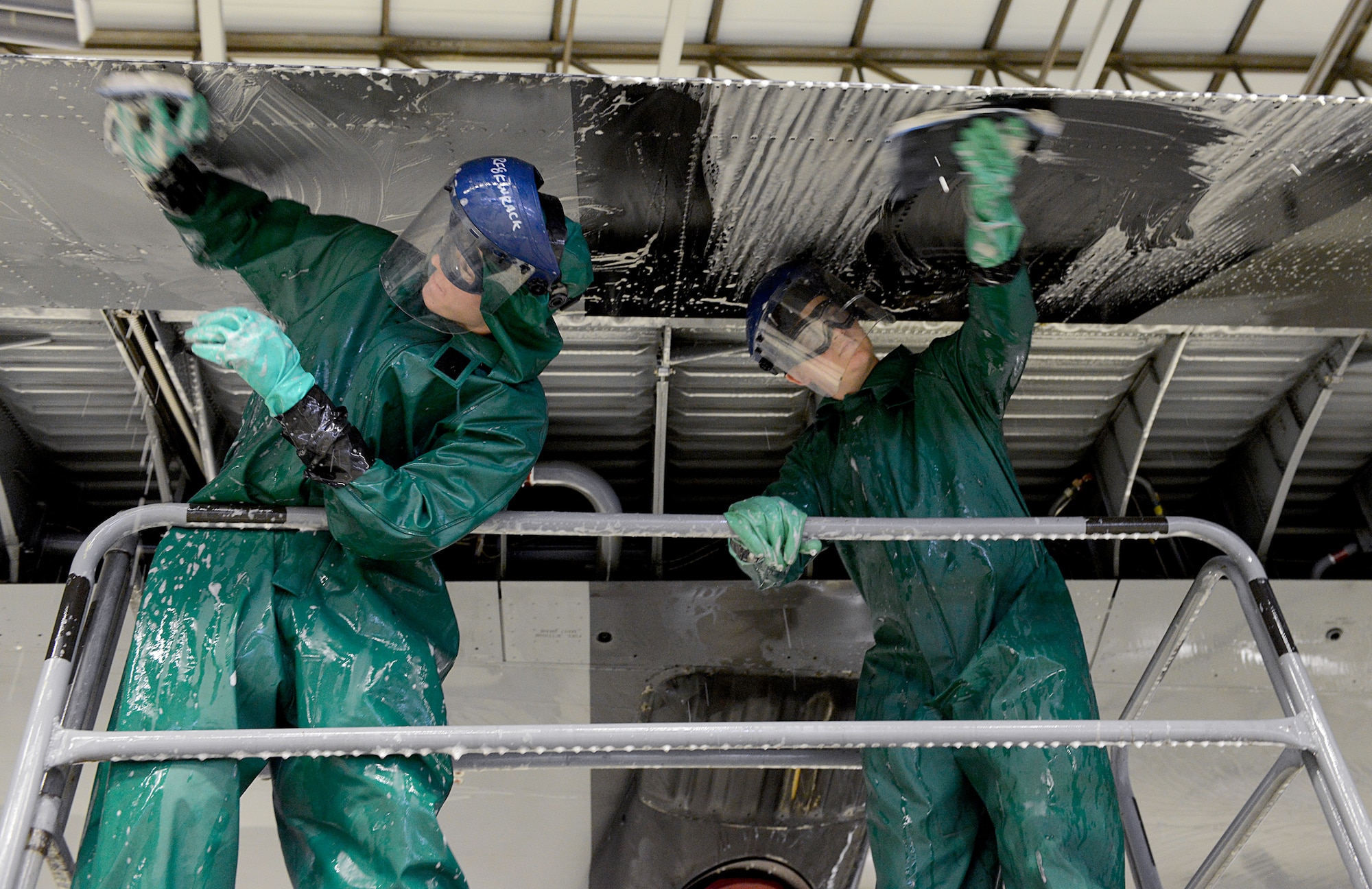 Airman 1st Class Ryan Kuiper, left, and Senior Airman Trevor Garner, both 86th Maintenance Squadron crew chiefs, scrub the wing of a C-130J Super Hercules Jan. 4, 2016, at Ramstein Air Base, Germany. The wash is preparation work for the aircraft’s C-2 isochronal (ISO) inspection. This examination marks the 14th and final C-2 ISO inspection for the 86th Airlift Wing until 2020. C-2 ISO inspections last approximately two weeks and require maintenance personnel to check the aircraft from tip to tip. (U.S. Air Force photo/Staff Sgt. Timothy Moore)