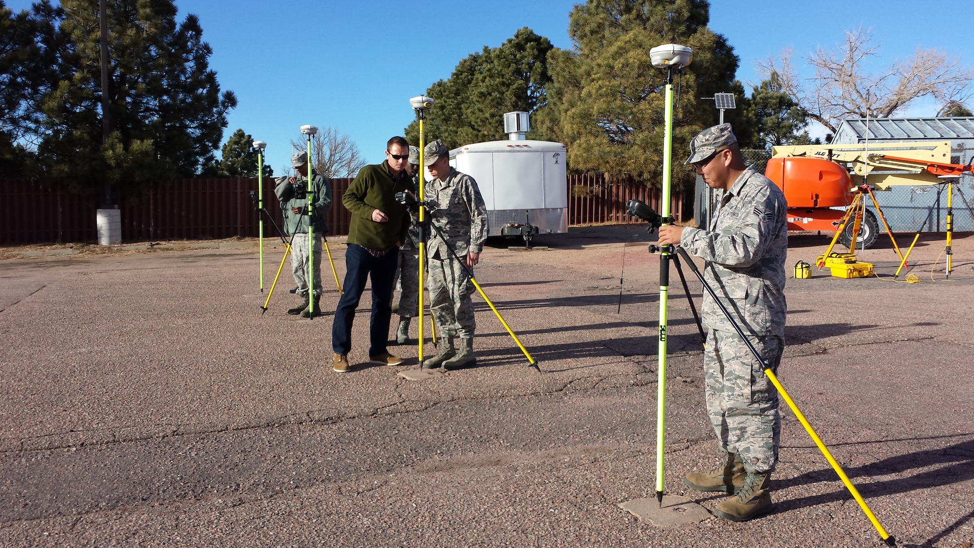 PETERSON AIR FORCE BASE, Colo. – Airmen from the 21st Civil Engineer Squadron execution support office receive training on GPS units Dec. 2, 2014 at the Civil Engineer Building. The equipment is used to collect data with sub centimeter accuracy in site surveys, which is then used to provide leadership with data to make informed decisions on renovation, maintenance and base infrastructure projects. (courtesy photo)