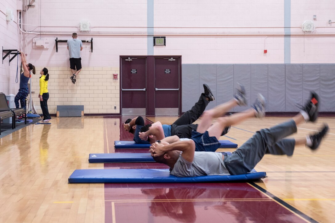 PETERSON AIR FORCE BASE, Colo. - Special Agents from the 8th Field Investigations Squadron of the Air Force Office of Special Investigations participate in a Hero Workout of the Day at the Peterson Air Force Base Fitness Center on Jan. 8, 2015. The workout was in honor of the six Airmen killed, four AFOSI special agents and two security forces defenders, while on patrol in Afghanistan on Dec. 21, 2015. (U.S. Air Force photo by Senior Airman Rose Gudex)