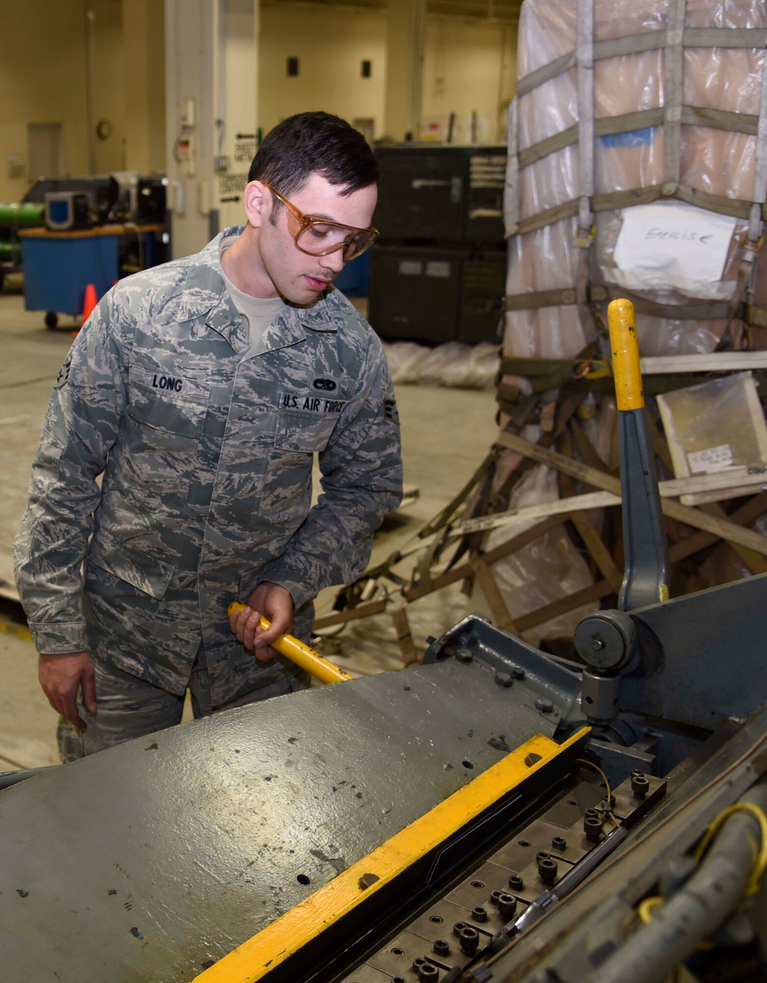 U.S. Air Force Senior Airman Charlton Long, an aircraft structural maintenance journeyman with the 35th Maintenance Squadron, bends metal to make an L-angle piece at Misawa Air Base, Japan, Jan. 11, 2016. Metal pieces shaped by the aircraft structural maintenance shop for an F-16 Fighting Falcon are tested before installment, ensuring safe flight. (U.S. Air Force photo by Airman 1st Class Jordyn Fetter)