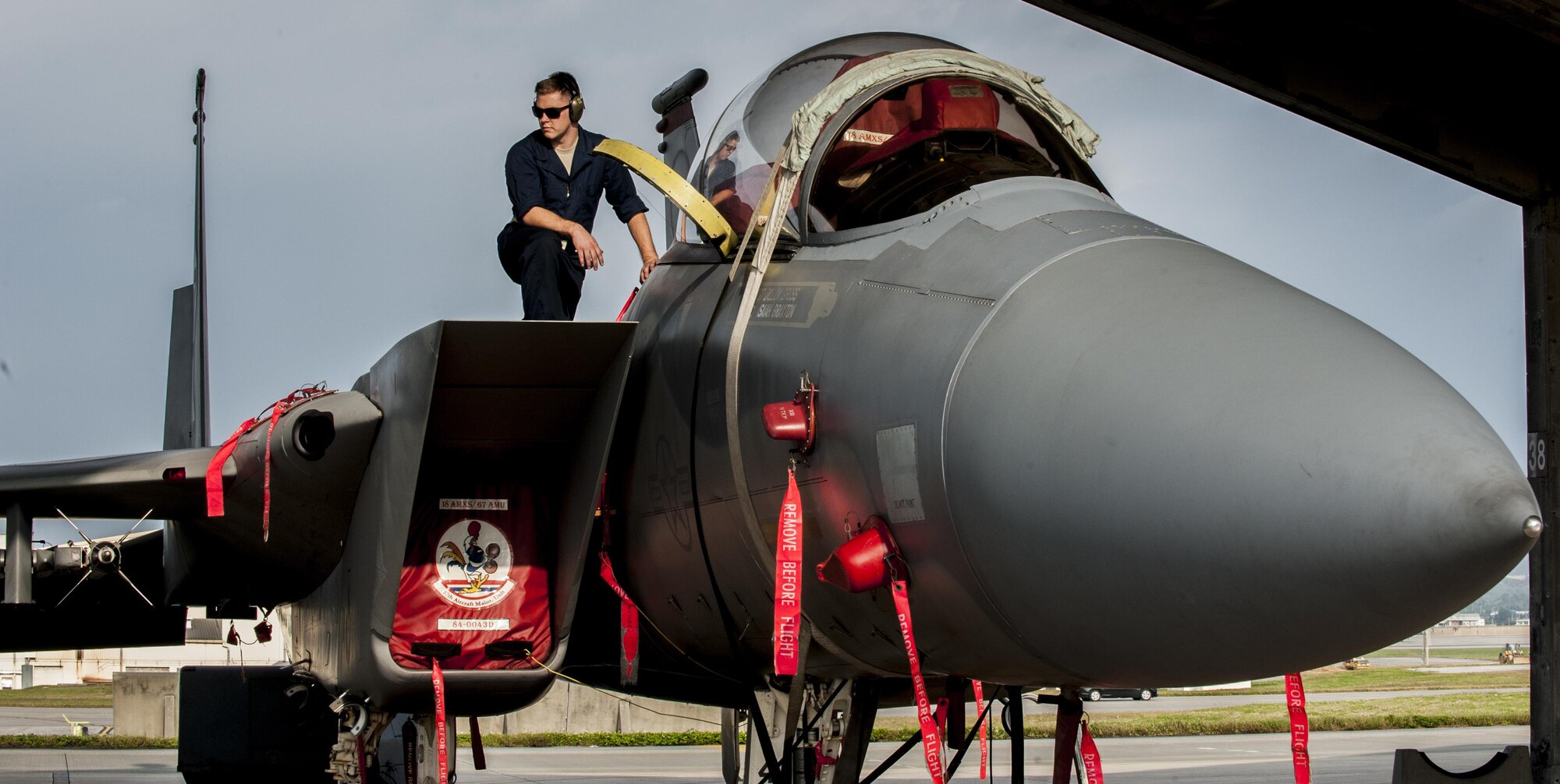 Airman 1st Class Justin Wanke, 67th Air Maintenance Unit electricity and environmental specialist, helps conduct a cabin pressure test on an F-15D Eagle, Jan. 8, 2016, on the flight line at Kadena Air Base, Japan. Cabin pressure tests are conducted to prevent hypoxia, a lack of oxygen reaching muscle tissue, from occurring in pilots. (U.S. Air Force photo by Airman 1st Class Nick Emerick) 