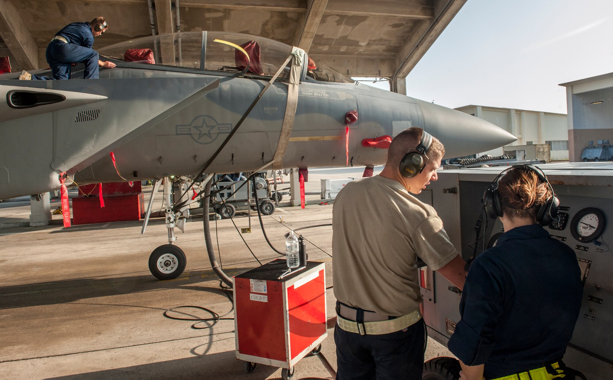 Airman 1st Class Justin Wanke, 67th Air Maintenance Unit electricity and environmental specialist, helps conduct a cabin pressure test on an F-15D Eagle, Jan. 8, 2016, on the flight line at Kadena Air Base, Japan. Cabin pressure tests are conducted to prevent hypoxia, a lack of oxygen reaching muscle tissue, from occurring in pilots. (U.S. Air Force photo by Airman 1st Class Nick Emerick) 
