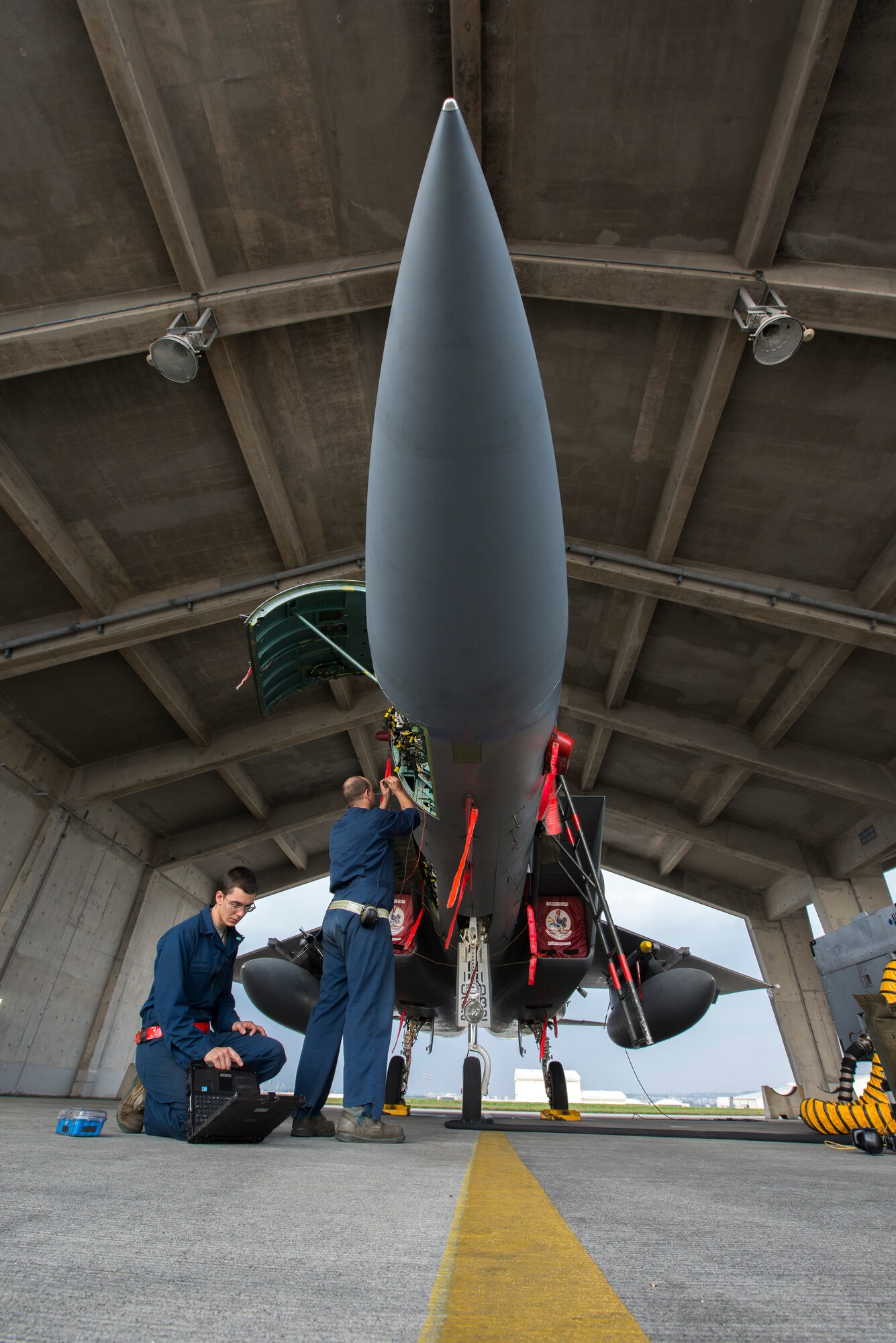 U.S. Air Force Airman 1st Class Sean Greig and Senior Airman Caleb Stephens, both 67th Aircraft Maintenance Unit avionics specialists, test F-15 Eagle components during maintenance Jan. 8, 2016, at Kadena Air Base, Japan. Avionics specialists are responsible to keep aircraft flight systems operating effectively. (U.S. Air Force photo by Staff Sgt. Maeson L. Elleman)