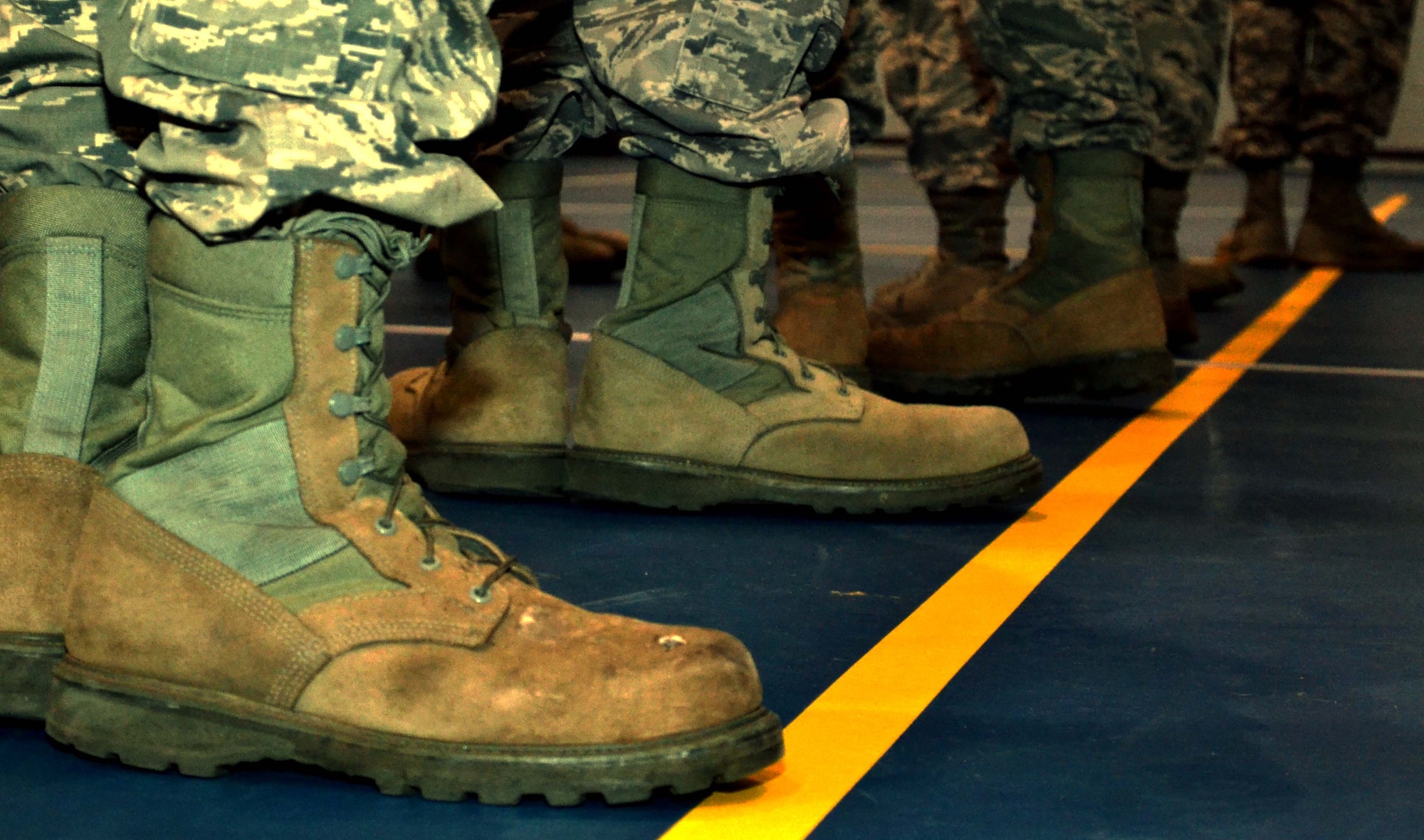 A row of boots belonging to new 111th Attack Wing Honor Guard members resemble the attempt at executing facing movement during the first official practice as a newly-renovated team Jan. 9, 2015 on the base basketball court at Horsham Air Guard Station, Pennsylvania. The team now has 17 members, but is actively recruiting more Guardsmen who wish to be committed to the honor guard. (U.S. Air National Guard photo/Tech. Sgt. Andria Allmond) 
