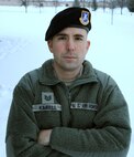 Tech. Sgt. Brent Kimbell, 319th Security Forces Squadron NCO-in-charge of anti-terrorism, poses in the snow Jan. 13, 2016, on Grand Forks Air Force Base, North Dakota. Kimbell was named the Air Force Outstanding Security Forces Flight Level NCO for 2015. (U.S. Air Force photo by Airman 1st Class Ryan Sparks/Released)