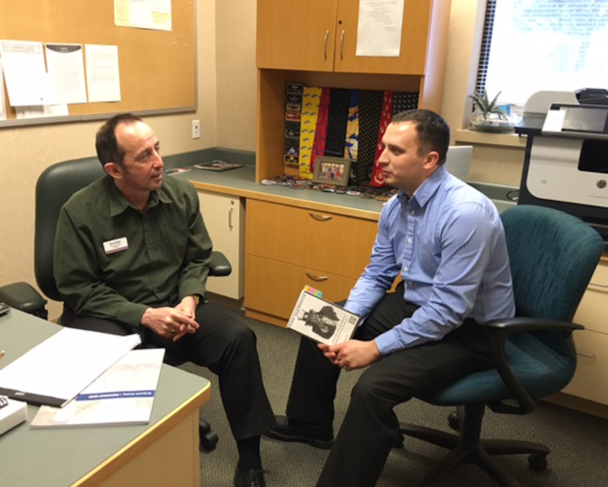 Gerd Scheller, 92nd Force Support Squadron Veterans Affairs Benefits advisor, assists Denis Yunin at the Airman and Family Readiness Center Jan. 12, 2016 at Fairchild Air Force Base, Wash. The VA advisors deliver outreach, employment and initiatives during the transition from military service to post-military career and economic outcomes. (Courtesy Photo) 