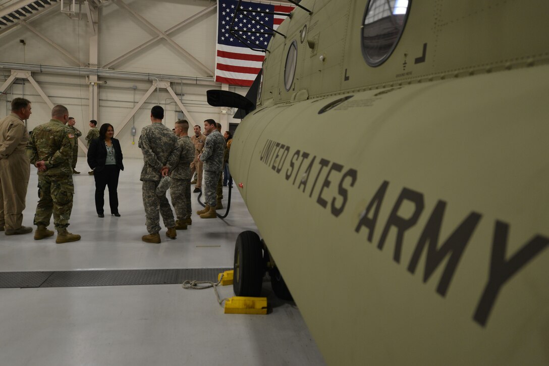 The Honorable Debra Wada, Assistant Secretary of the Army for Manpower and Reserve Affairs, speaks with members of the 159th General Support Aviation Battalion at Fort Eustis, Va., Jan. 11, 2015. After touring CH-47 Chinook helicopters, Wada spoke with the group to gain insight about the missions and challenges the Service members face. (U.S. Air Force photo by Staff Sgt. Natasha Stannard)