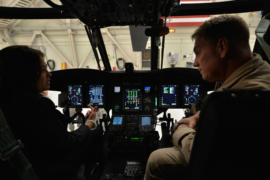 Chief Warrant Officer 4 Kelly Huck, Battalion movement officer for the 159th General Support Aviation Battalion’s Bravo Company, speaks with the Honorable Debra Wada, Assistant Secretary of the Army for Manpower and Reserve Affairs, at Fort Eustis, Va., Jan. 11, 2015. Along with an overview of the 159th’s mission and capabilities, Huck also discussed improvements for U.S. Army Reserve aviators. (U.S. Air Force photo by Staff Sgt. Natasha Stannard)