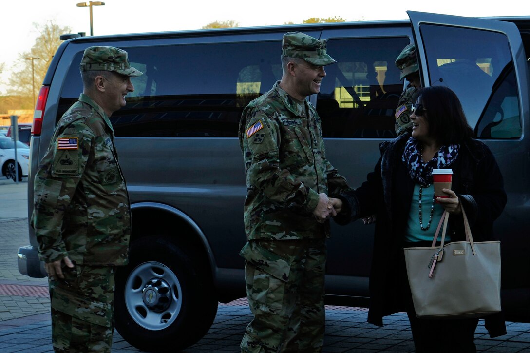 U.S. Army Gen. David Perkins, the commander of the U.S. Army Training and Doctrine Command (TRADOC), and U.S. Army Command Sgt. Maj. David Davenport of TRADOC, greet the Honorable Debra Wada, Assistant Secretary of the Army for Manpower and Reserve Affairs, at the TRADOC headquarters building on Fort Eustis, Va., Jan. 11, 2016. Wada visited the TRADOC headquarters, the 7th Transportation Brigade (Expeditionary) and the  159th Aviation Battalion. (U.S. Air Force photo by Senior Airman Breonna Veal) 
