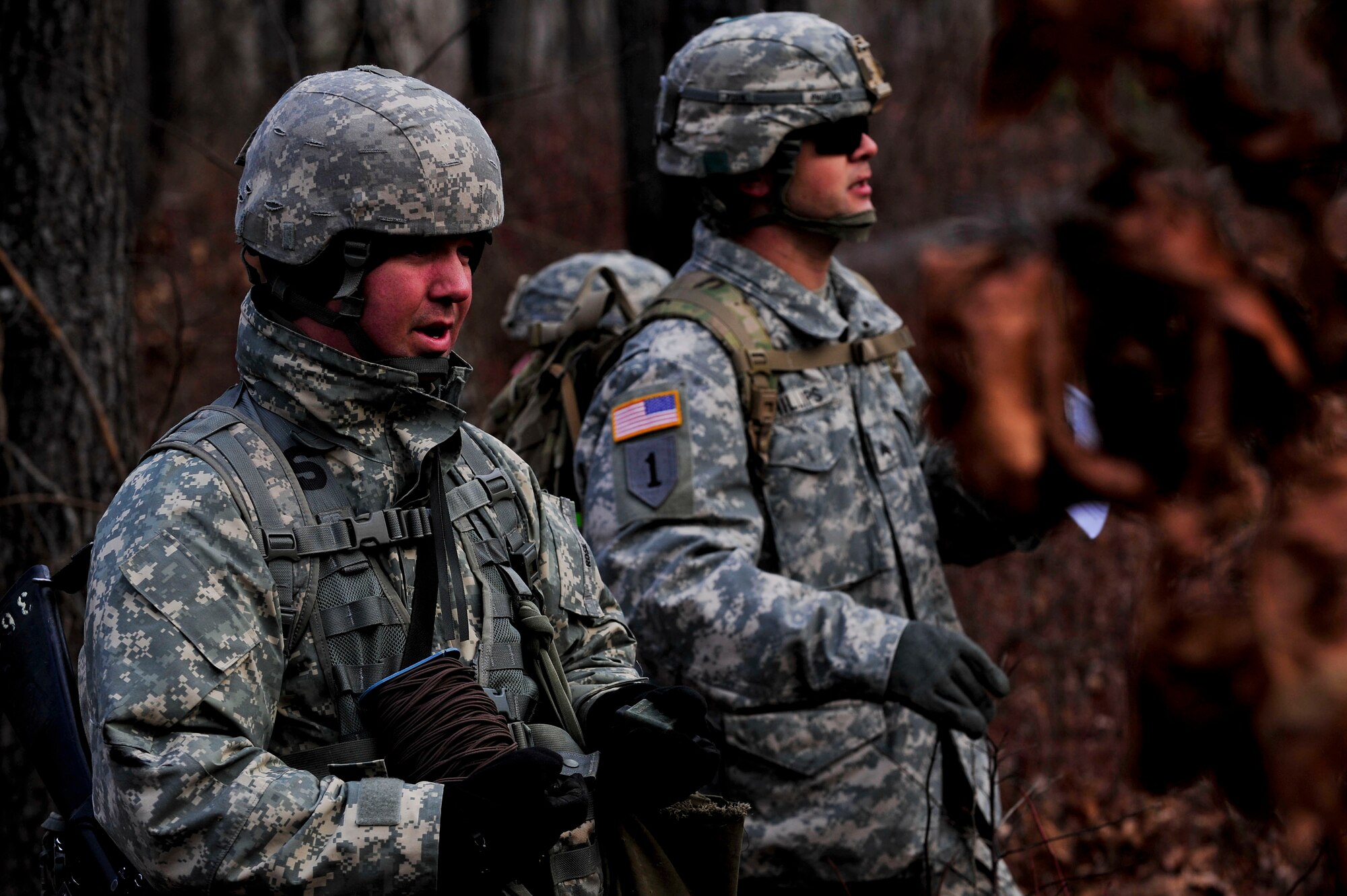 U.S. Army Soldiers assigned to the 73rd Transportation Floating Craft Company of the 19th Transportation Battalion, 7th Transportation Brigade (Expeditionary), conduct an after-action report on the team’s ability to locate and overtake an enemy position during a field training exercise at Fort A.P. Hill, Va., Jan. 12, 2016. Personnel spent approximately eight hours in the terrain using teamwork skills to complete the four objectives. (U.S. Air Force photo by Senior Airman Breonna Veal)