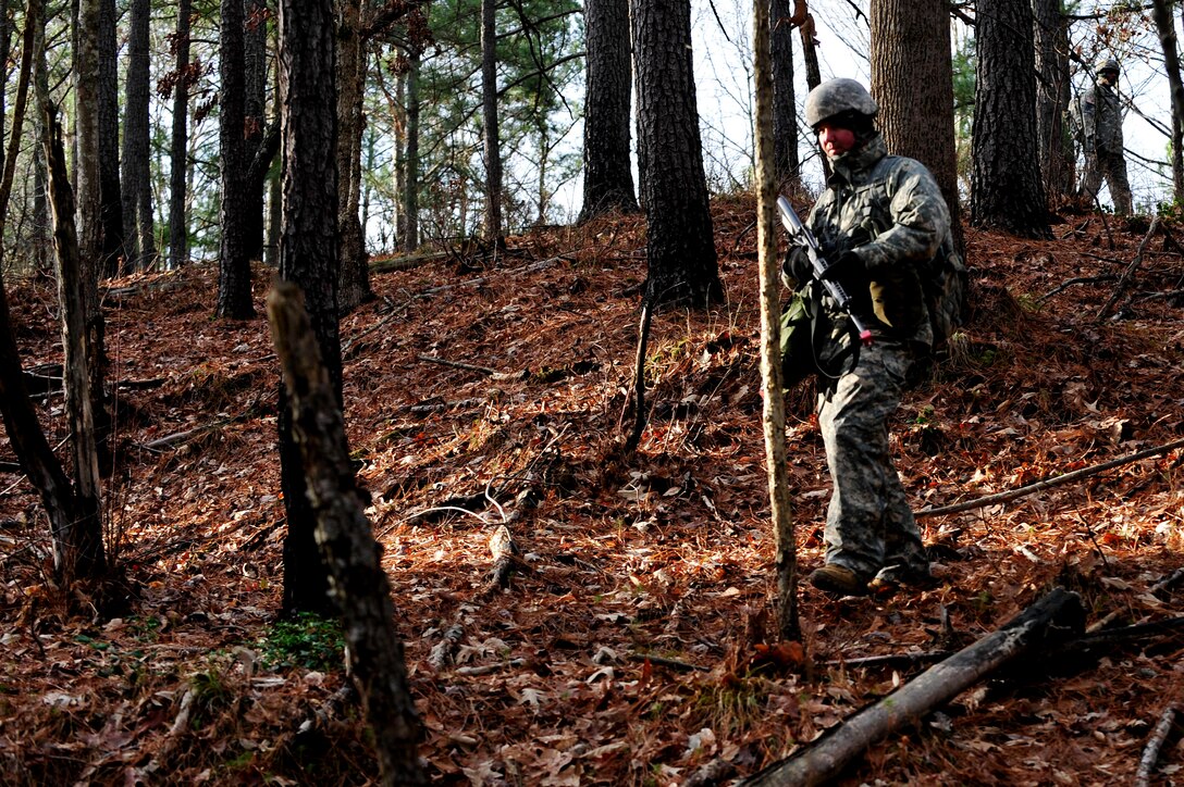 A U.S. Army Soldier from the 73rd Transportation Floating Craft Company of the 19th Transportation Battalion, 7th Transportation Brigade (Expeditionary), treks down a hill during a field training exercise at Fort A.P. Hill, Va., Jan. 12, 2016. The mission began with an operations briefing where squad leaders were given the information needed to execute the mission, to include objective location, available resources and enemy capabilities. (U.S. Air Force photo by Senior Airman Breonna Veal)
