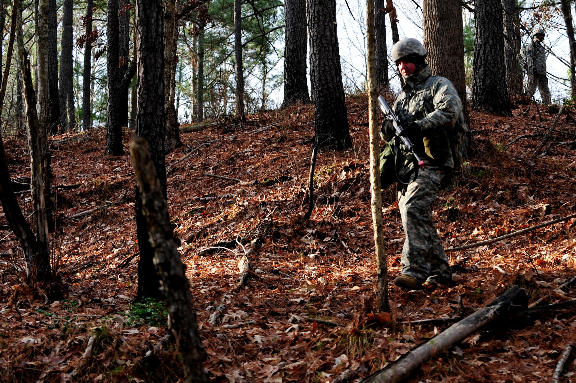 A U.S. Army Soldier from the 73rd Transportation Floating Craft Company of the 19th Transportation Battalion, 7th Transportation Brigade (Expeditionary), treks down a hill during a field training exercise at Fort A.P. Hill, Va., Jan. 12, 2016. The mission began with an operations briefing where squad leaders were given the information needed to execute the mission, to include objective location, available resources and enemy capabilities. (U.S. Air Force photo by Senior Airman Breonna Veal)