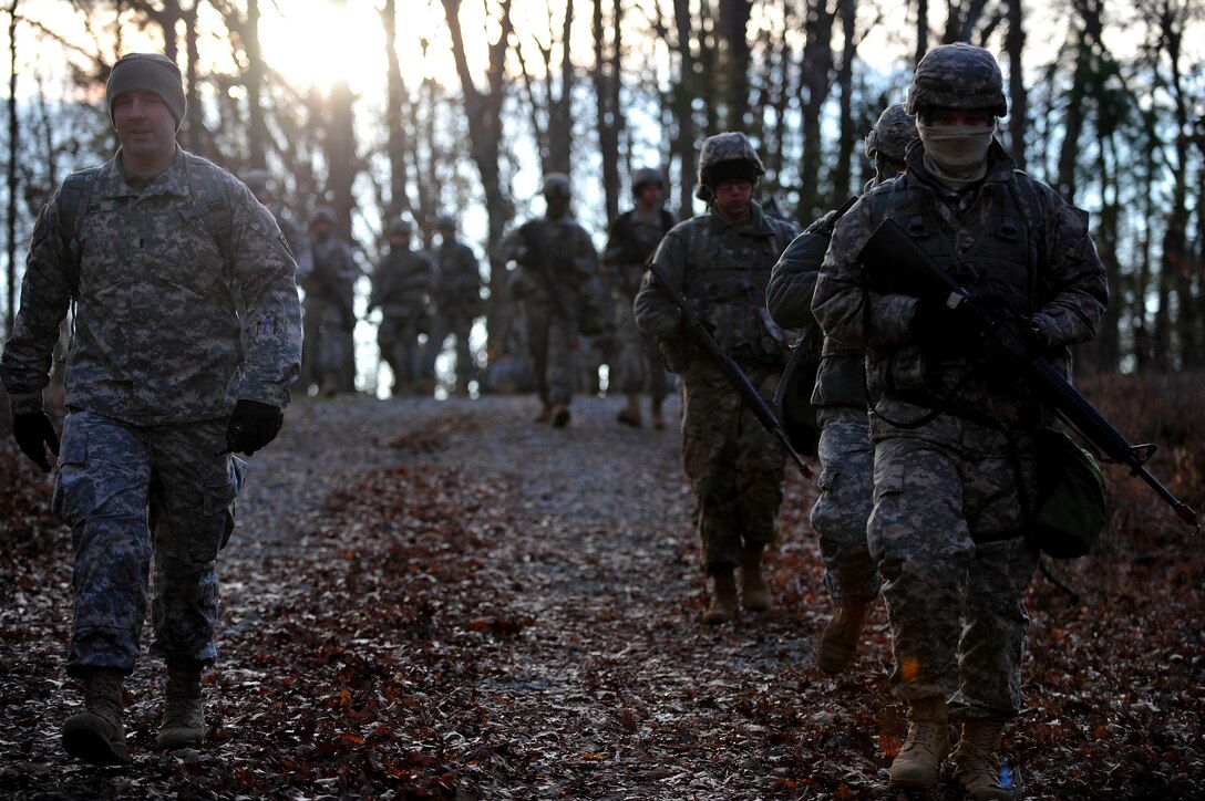 U.S. Soldiers assigned to the 73rd Transportation Floating Craft Company of the 19th Transportation Battalion, 7th Transportation Brigade (Expeditionary) walk to a rally point during a field training exercise at Fort A.P. Hill, Va., Jan. 12, 2016. The exercise featured four simultaneous lanes, which tested warrior tasks and battle drills of each squad, each of which consisted of 10 to 15 personnel.  (U.S. Air Force photo by Senior Airman Breonna Veal)