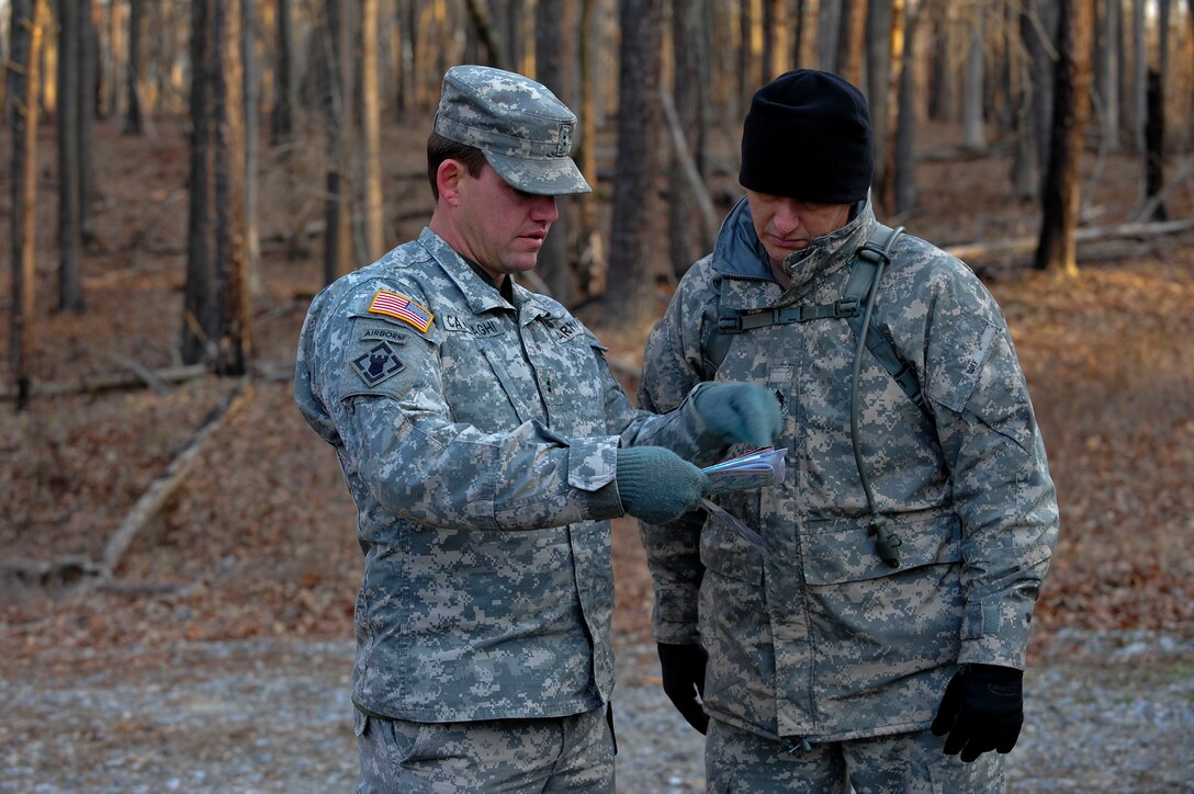 U.S. Soldiers assigned to the 73rd Transportation Floating Craft Company of the 19th Transportation Battalion, 7th Transportation Brigade (Expeditionary), review the points of training during a field training exercise at Fort A.P. Hill, Va., Jan. 12, 2016. The Fort Eustis Soldiers participated in the FTX to validate training in land navigation, individual movement, warrior tasks and drills. (U.S. Air Force photo by Senior Airman Breonna Veal) 