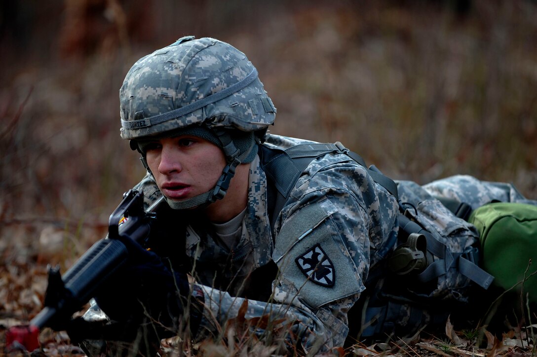 A U.S. Soldier assigned to the 73rd Transportation Floating Craft Company of the 19th Transportation Battalion, 7th Transportation Brigade (Expeditionary), keeps lookout during a field training exercise at Fort A.P. Hill, Va., Jan. 12, 2016. Each squad of 10 to 15 Soldiers included a squad leader, medical specialist and navigator. (U.S. Air Force photo by Senior Airman Breonna Veal)