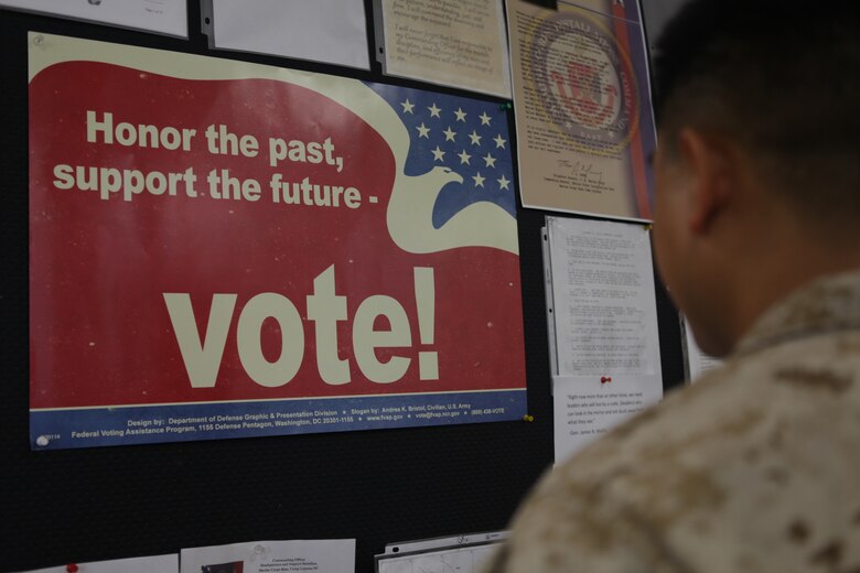 Posters encouraging Marines to engage the political systems they defend hang in various locations throughout Marine Corps Base Camp Lejeune. According to DoD Directive 1344.10, Political Activities by Members of the Armed Forces, it is the policy to encourage DoD civilians and active duty members to carry out the obligations of citizenship without endorsing or implying an endorsement for a political party.  (Courtesy photo)