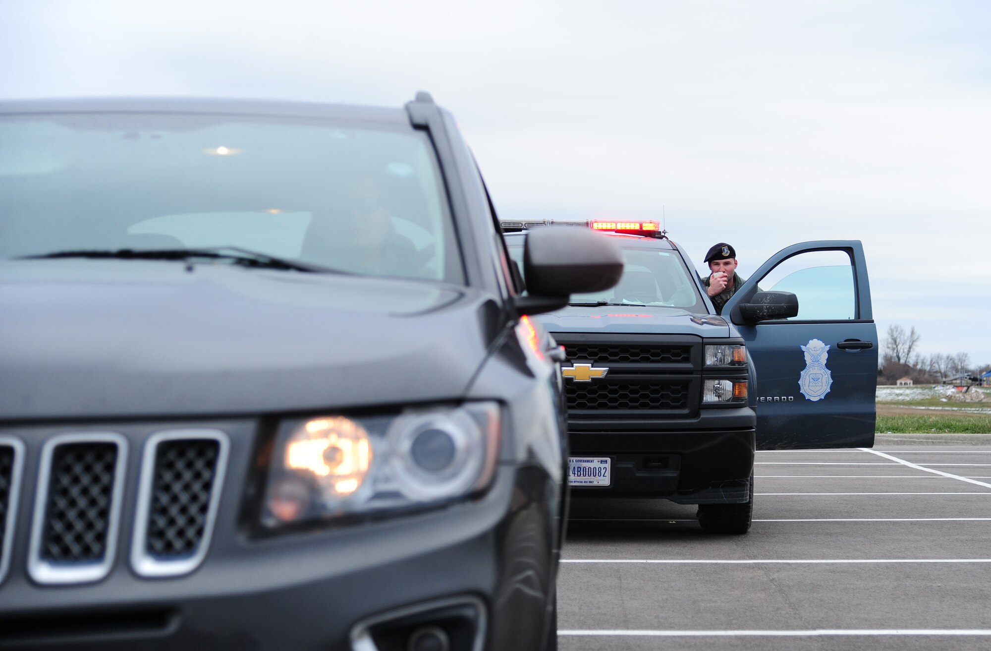 U.S. Air Force Staff Sgt. Mathew Meron, 509th Security Forces desk sergeant, performs a routine traffic stop at Whiteman Air Force Base, Mo., Jan. 6, 2016. Meron has been in the Air Force for nine years and has been stationed at two different duty stations, Whiteman, and Offutt Air Force Base, Nebraska. (U.S. Air Force photo by Senior Airman Joel Pfiester)