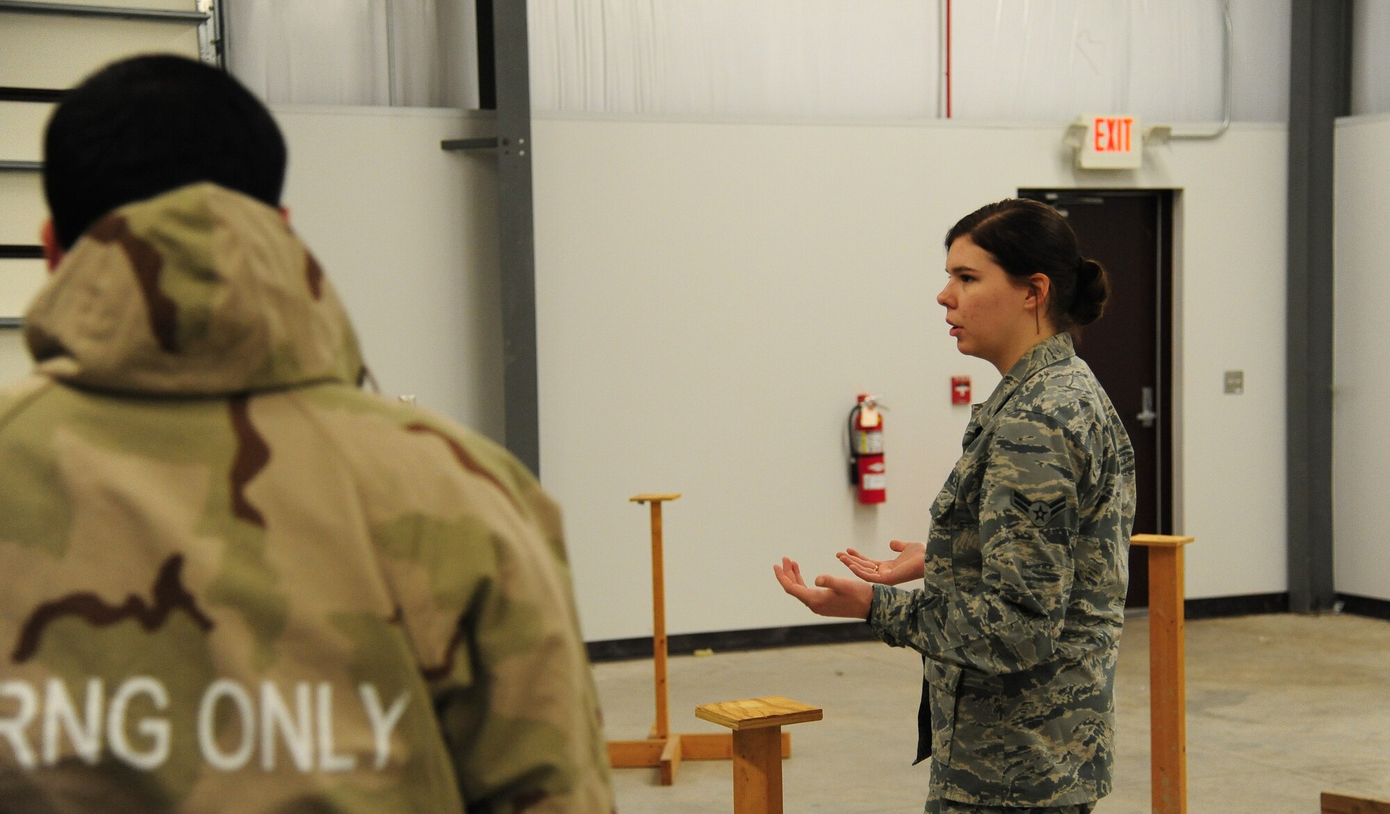 Airman 1st Class Amber Edgell, a 509th Civil Engineer Squadron emergency management specialist, goes over a training scenario during a chemical, biological, radiological, nuclear and explosives (CBRNE) course at Whiteman Air Force Base, Mo., Jan. 12, 2016. Edgell has been in the Air Force since March 2015 and has been stationed at Whiteman since September 2015. (U.S. Air Force photo by Senior Airman Joel Pfiester)
