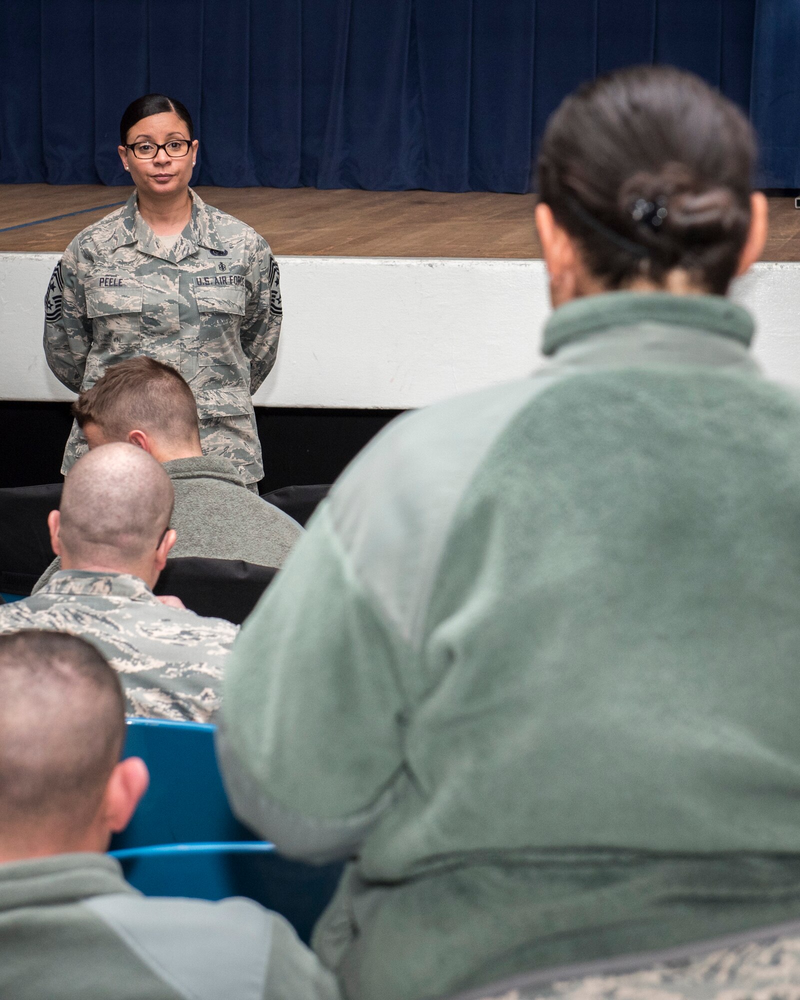 PETERSON AIR FORCE BASE, Colo. – Chief Master Sgt. Idalia Peele, 21st Space Wing command chief, answers questions from Peterson Airmen during an open forum here about the changes to the Enlisted Forced Distribution process Jan. 8, 2015. During the sessions, she talked about the rules of engagement, the timeline and the overall effects of EFD on promotion. (U.S. Air Force photo by Senior Airman Rose Gudex)