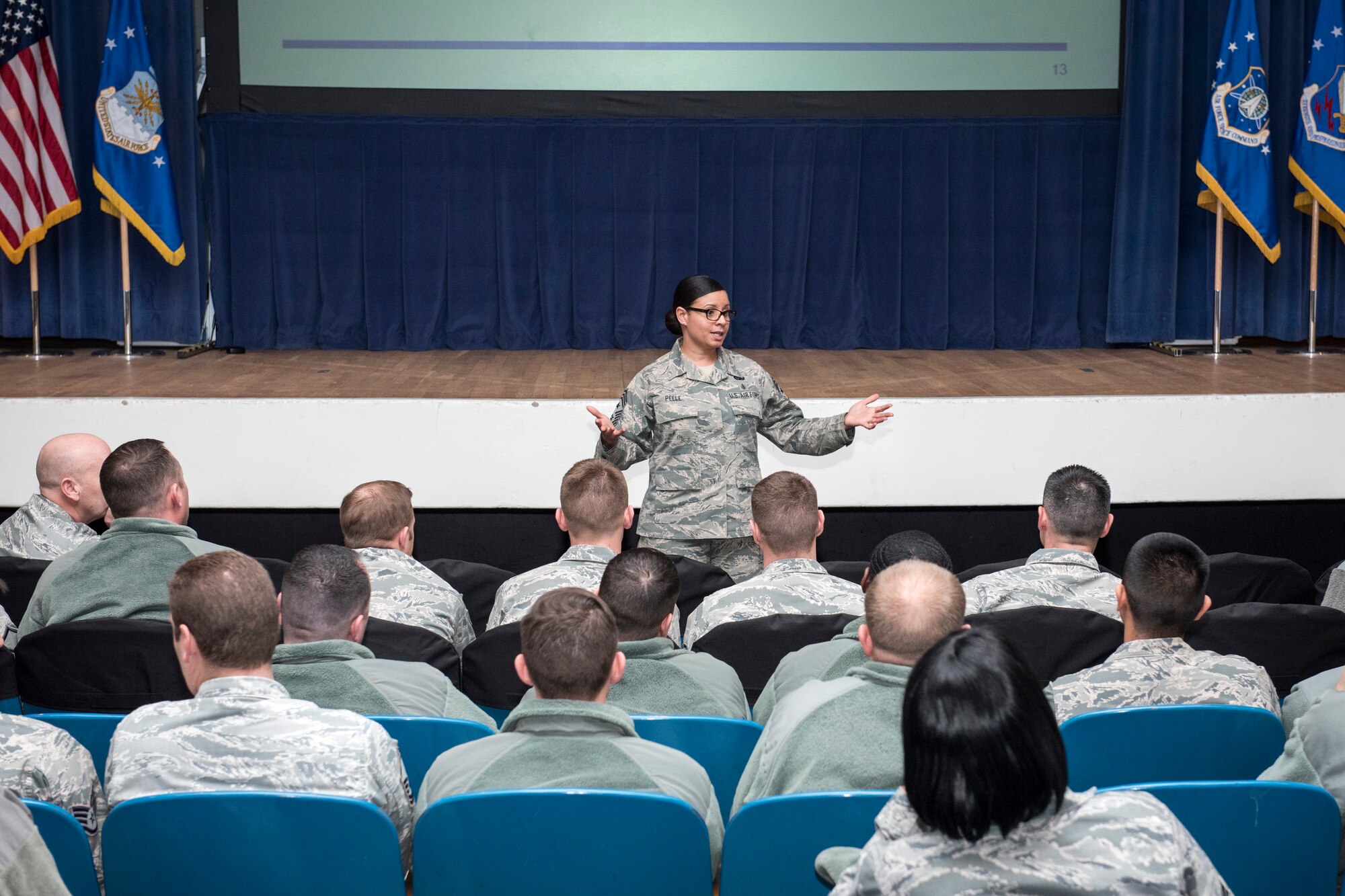 PETERSON AIR FORCE BASE, Colo. – Chief Master Sgt. Idalia Peele, 21st Space Wing command chief, talks about the Enlisted Forced Distribution process to 21st SW Airmen here Jan. 8, 2015. Peele conducted three sessions Jan. 7 and 8. During the sessions she talked about the rules of engagement, the timeline and the overall effects of EFD on promotion. (U.S. Air Force photo by Senior Airman Rose Gudex)