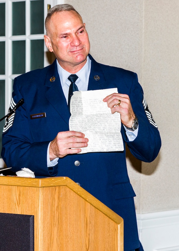 During his retirement ceremony at Marine Corps Base, Quantico, Va., Jan. 8, Air Force Office of Special Investigations Command Chief Master Sergeant Walker H. Cottingham shares a morale building letter from his wife Terri sent to him during his military career. (U.S. Air Force photo/Michael Hastings)    