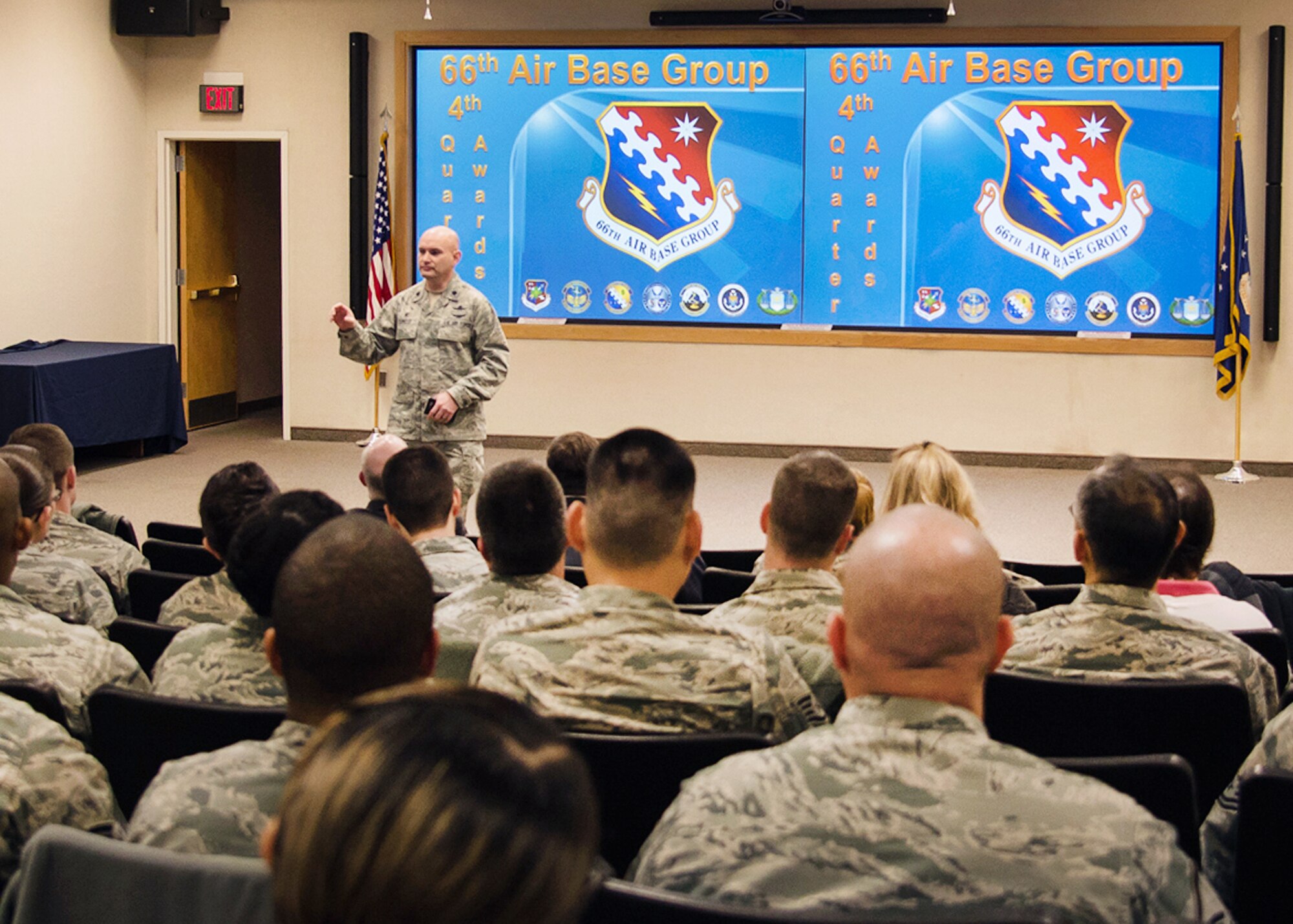 Lt. Col. David R. Dunklee, 66th Air Base Group commander, speaks during the ABG Quarterly Awards Ceremony at the Hanscom Conference Center Jan. 12. Dunklee and Command Chief Master Sgt. Patricia L. Hickey presented the awards to each of the 12 winners. (U.S. Air Force photo by Walter Santos)