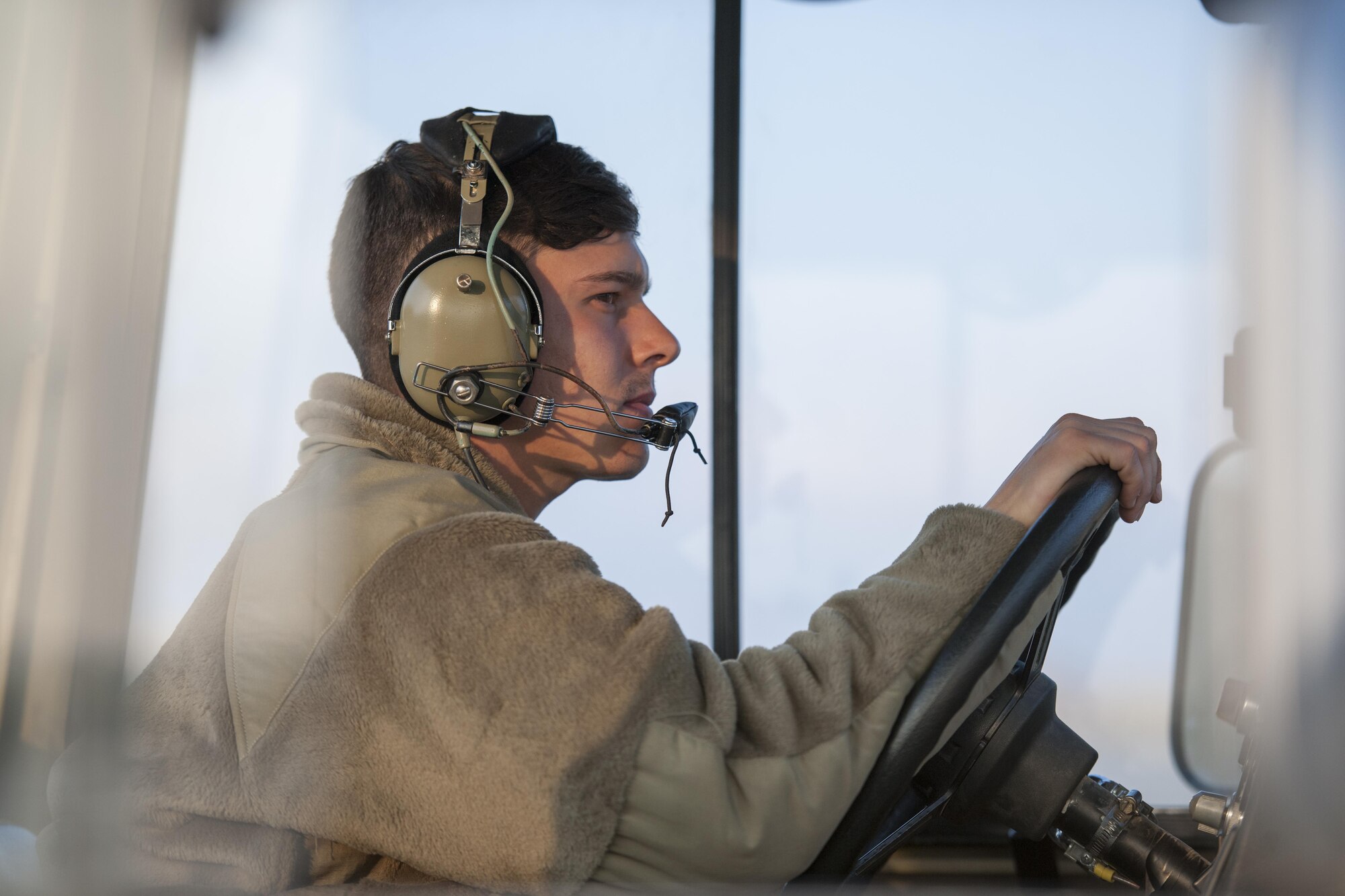 Airman 1st Class Alec Flores, 455th Expeditionary Aircraft Maintenance Squadron crew chief, tows a C-130J Super Hercules to the flightline for an engine test at Bagram Airfield, Aghanistan, Jan. 12, 2016. The 455th EAMXS ensures that Super Hercules at Bagram are prepared for flight and return them to a mission-ready state once they land. (U.S. Air Force photo/Tech. Sgt. Robert Cloys) 