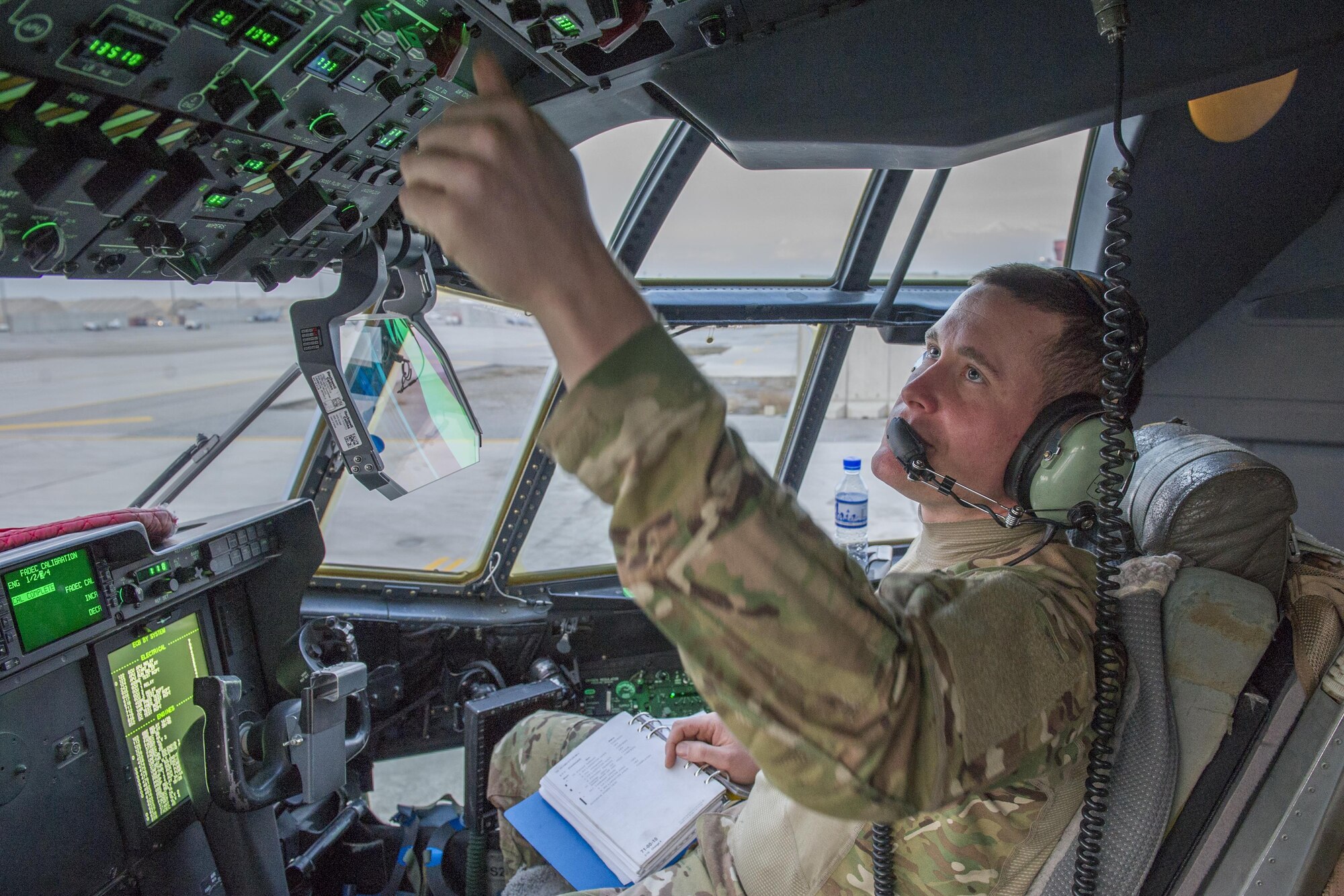 Staff Sgt. Terry Fesler, 455th Expeditionary Aircraft Maintenance Squadron aerospace propulsion craftsman, sits in the capplies bleed air to an engine on a C-130J Super Hercules at Bagram Airfield, Aghanistan, Jan. 12, 2016. The 455th EAMXS ensures that Super Hercules at Bagram are prepared for flight and return them to a mission-ready state once they land. (U.S. Air Force photo/Tech. Sgt. Robert Cloys) 