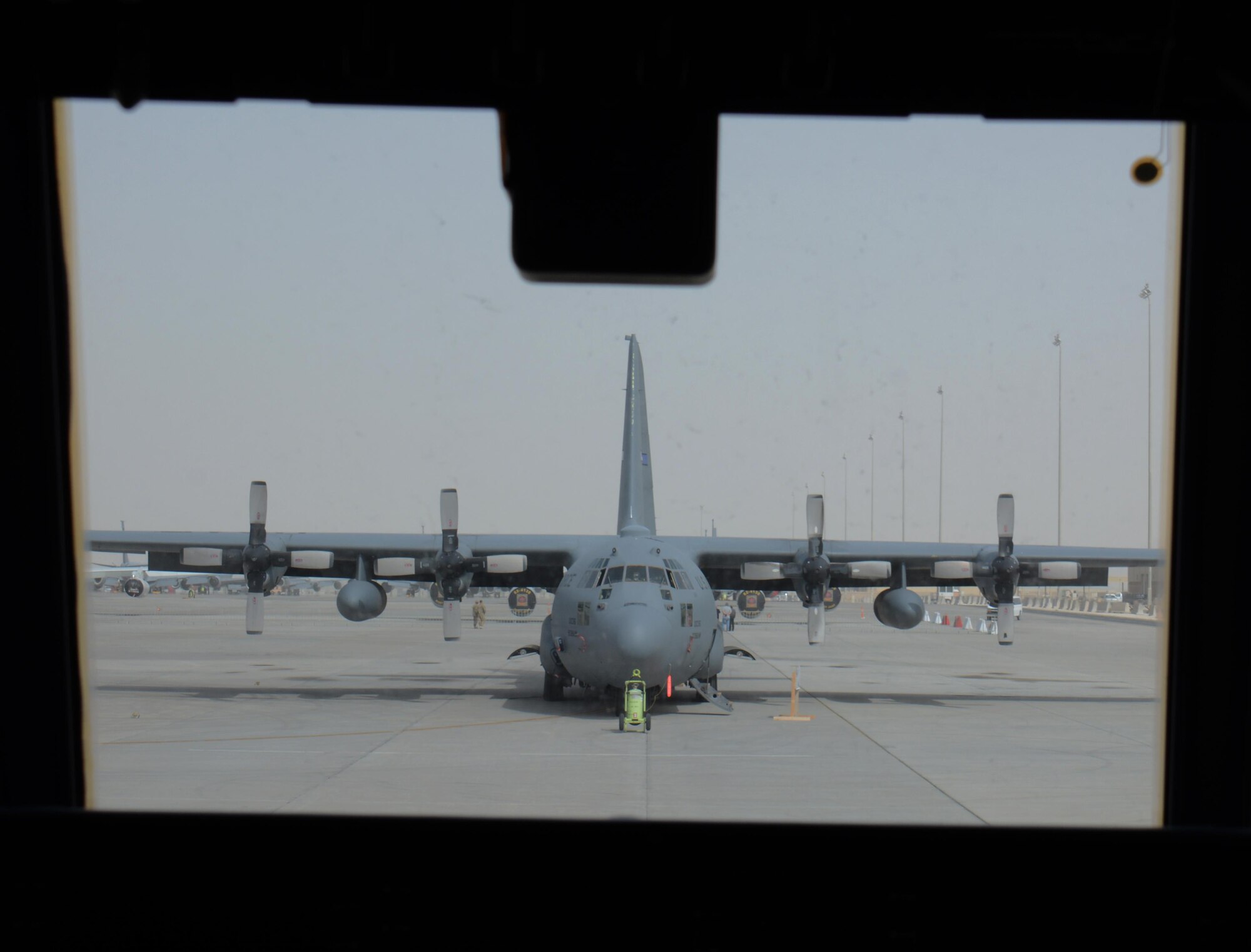 A C-130 Hercules deployed from Maxwell Air Force Base, Alabama, waits for visitors at the annual Flight Line Fest Jan. 10 at Al Udeid Air Base, Qatar. The plane, which can take-off with a maximum weight of 155,000 pounds, was one of five U.S. Air Force aircraft on display during the event. Flight Line Fest is a joint partnership between the 379th Air Expeditionary Wing and Qatar Emiri Air Force held to foster relations between Qatar and the United States. (U.S. Air Force photo by Tech. Sgt. James Hodgman/Released)