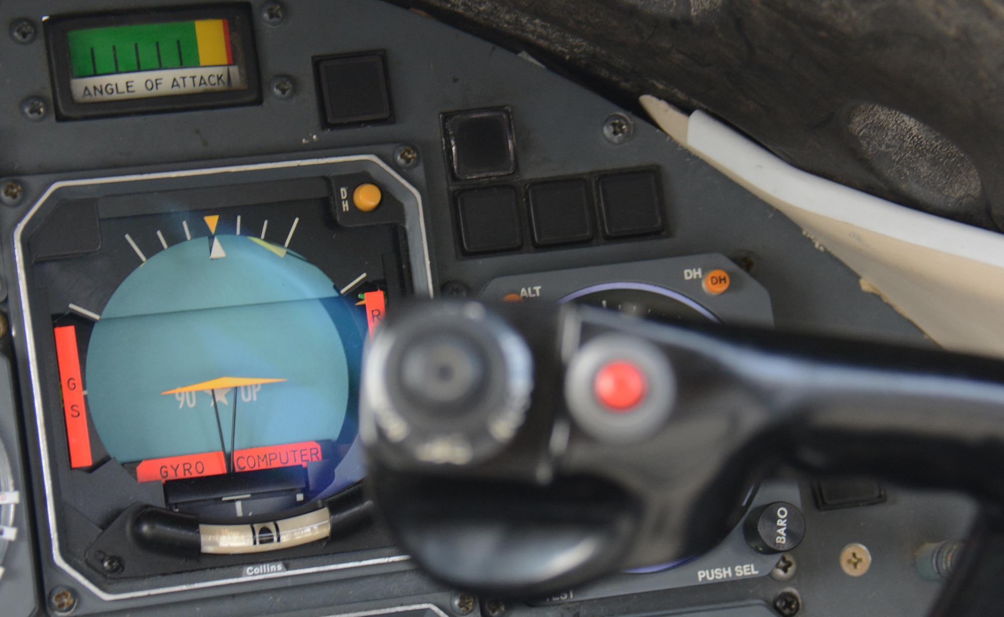 An attitude direction indicator is displayed inside the cockpit of a C-21 Learjet at the annual Flight Line Fest at Al Udeid Air Base, Qatar, Jan. 10. The ADI provides pilots with important information such as the pitch they must maintain to keep the aircraft level during flight. The C-21 was a popular attraction during the event as many people asked for tours of the aircraft. Flight Line Fest is a joint partnership between the 379th Air Expeditionary Wing and Qatar Emiri Air Force held to foster relations between Qatar and the United States. (U.S. Air Force photo by Tech. Sgt. James Hodgman/Released)