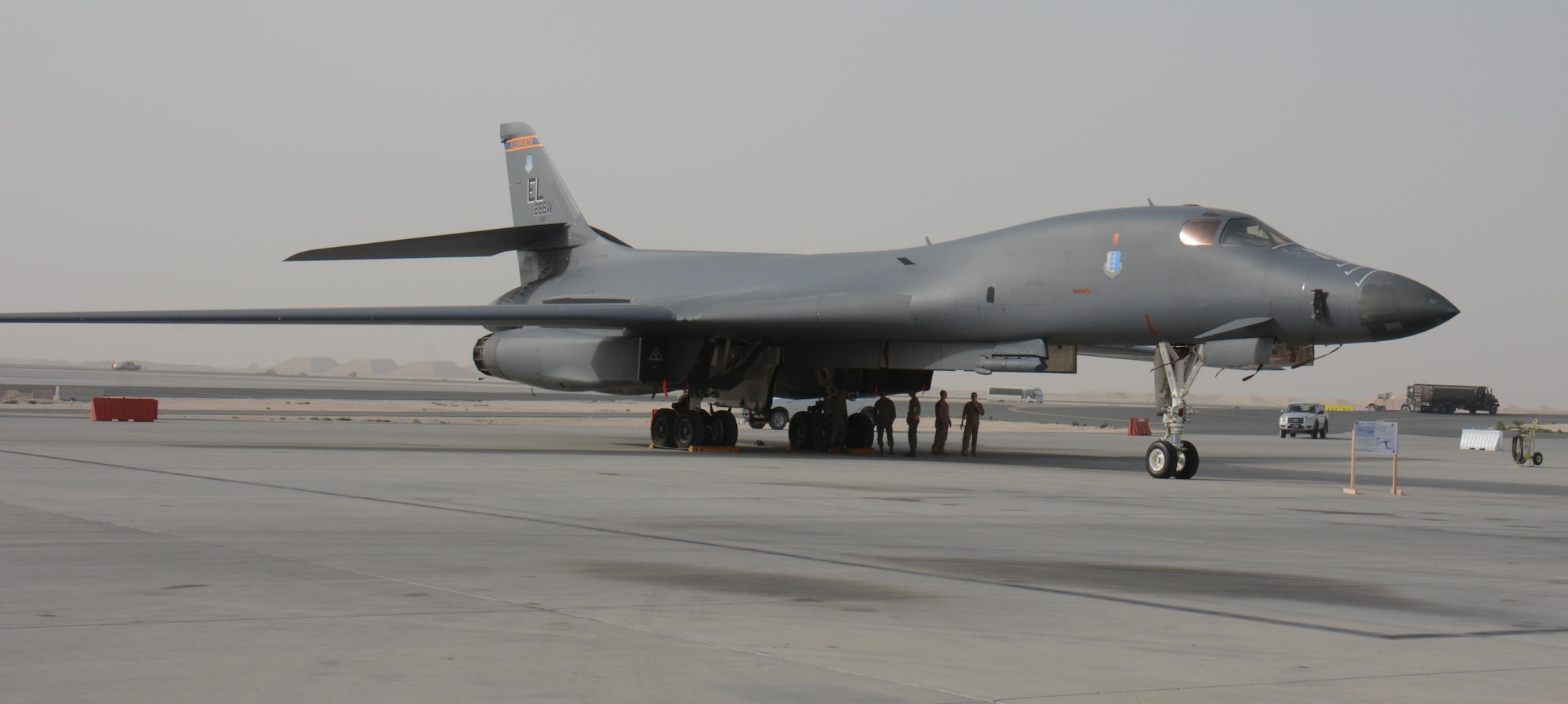 A B-1B Lancer waits for visitors at the annual Flight Line Fest Jan. 10 at Al Udeid Air Base, Qatar. The B-1B fleet at AUAB has dropped thousands of weapons on enemy targets in support of Operations Inherent Resolve and Freedom’s Sentinel over the past year. The B-1B was one of five U.S. Air Force aircraft on display during the event. Flight Line Fest is a joint partnership between the 379th Air Expeditionary Wing and Qatar Emiri Air Force held to foster relations between Qatar and the United States. (U.S. Air Force photo by Tech. Sgt. James Hodgman/Released)