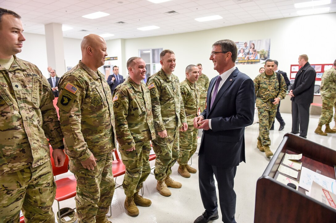 Defense Secretary Ash Carter shares a light moment with a soldier at the Soldier Readiness Processing and Family Assistance Center on Fort Campbell, Ky., Jan. 13, 2016. DoD photo by Army Sgt. 1st Class Clydell Kinchen