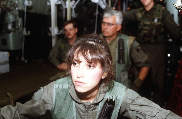 Tech. Sgt. Theresa Hillis, of the 68th Aeromedical Evacuation Squadron at Norton Air Force Base, Calif.; Senior Master Sgt. James Cundall, right, of the 118th AES, Tennessee Air National Guard, Nashville, Tenn.; and Tech. Sgt. Dennis Mulline, left, of the 137th AES, receive a mission briefing during Operation Desert Storm. (Courtesy photo)