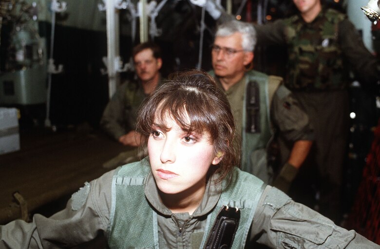 Tech. Sgt. Theresa Hillis, front, of the 68th Aeromedical Evacuation Squadron (AES), Norton Air Force Base, Calif.; Senior Master Sgt. James Cundall, right, of the 118th AES, Tennessee Air National Guard, Nashville, Tenn.; and Tech. Sgt. Dennis Mulline, left, of the 137th AES receive a mission briefing during Operation Desert Storm.