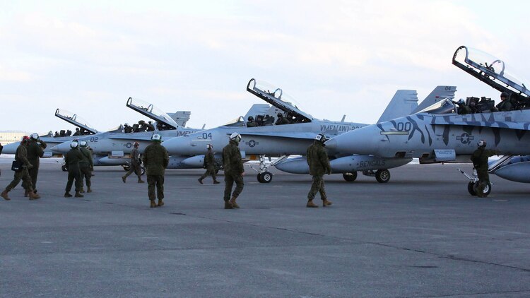 Maintainers with Marine All-Weather Fighter Attack Squadron 224 approach F/A-18D Hornets that arrived from Marine Corps Air Station Iwakuni to Chitose Air Base in Hokkaido, Japan, Jan. 12, 2016. VMFA (AW)-224, homebased at MCAS Beaufort, S.C., is temporarily based in Iwakuni on a unit deployment program and deployed to Northern Japan to participate in the Chitose Aviation Training Relocation Exercise Jan. 12-22. During the exercise, the squadron conducted dissimilar air combat training with and against the Japan Air Self-Defense Force to further support combined interoperability and Pacific theater security cooperation.  