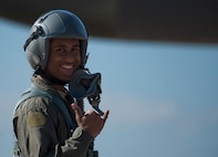 U.S. Air Force Staff Sgt. Ariful Haque, 7th Civil Engineer Squadron water and fuels craftsman, shows his excitement while waits to board a B-1B Lancer Nov. 20, 2015, at Dyess Air Force Base, Texas. Haque was one of two Airmen nominated to fly as a passenger as part of an incentive program rewarding superior-performing Airmen for the month of November. (U.S. Air Force photo by Airman Quay Drawdy/Released)