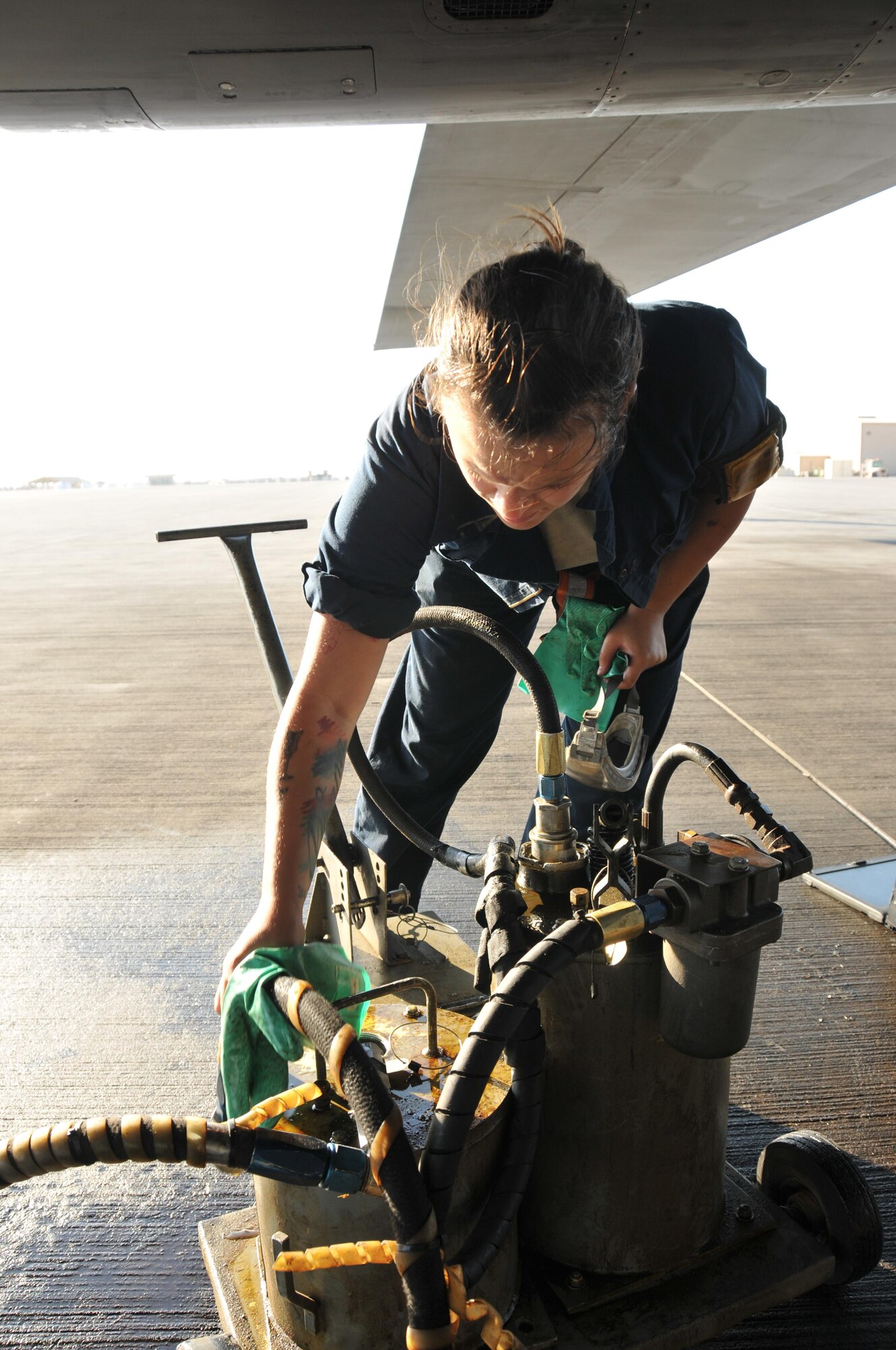 Senior Airman Alexis Anderson, 379th Expeditionary Aircraft Maintenance Squadron crew chief, performs a post-flight inspection on a B-1 B Lancer Jan. 11 at Al Udeid Air Base, Qatar. After a B-1 mission is complete, Anderson and other maintainers, perform several post flight inspections to ensure the aircraft is mission ready. Anderson is deployed from the 307th Expeditionary Aircraft Maintenance Unit at Ellsworth Air Force Base, South Dakota. (U.S. Air Force photo by Tech. Sgt. Terrica Y. Jones/Released)