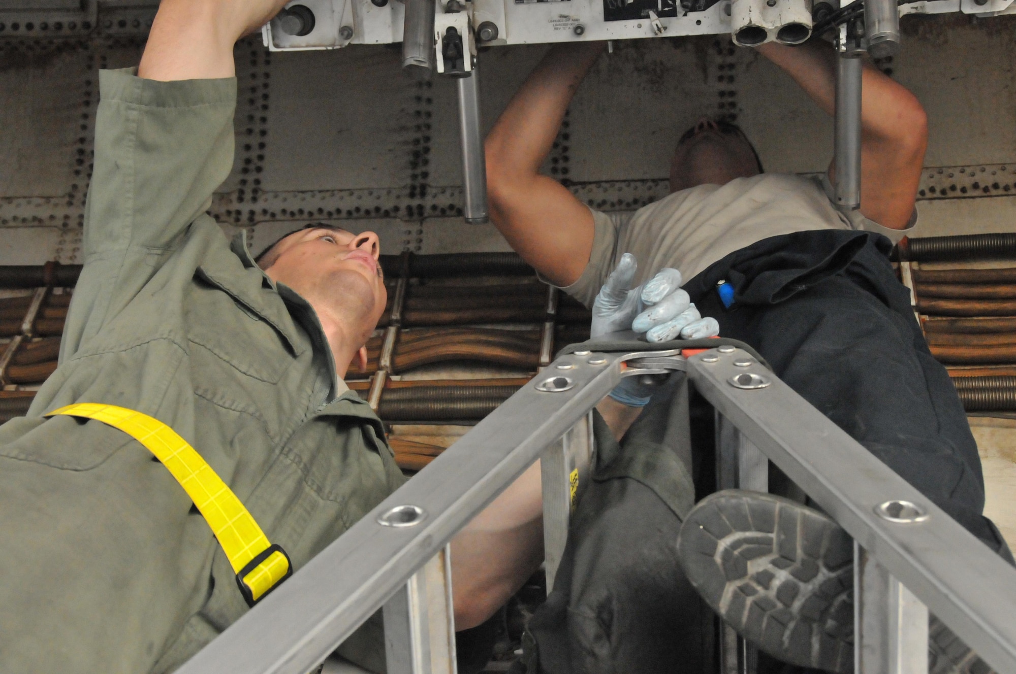 Crew chiefs from 379th Expeditionary Aircraft Maintenance Squadron perform an engine inspection on a B-1 B Lancer Jan. 11 at Al Udeid Air Base, Qatar. The crew chiefs check the engine for damage and for loose wiring that may have happened during a B-1 mission. The maintainers are deployed from the 307th Expeditionary Aircraft Maintenance Unit at Ellsworth Air Force Base, South Dakota. (U.S. Air Force photo by Tech. Sgt. Terrica Y. Jones/Released)