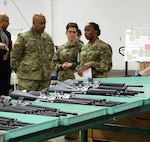 Army Lt. Col. Hattie Richardson, DLA Distribution Anniston’s commander, right, discusses the organization’s small arms mission with Army Lt. Gen. Larry Wyche, Army Material Command’s deputy commanding general, left, during his visit to the distribution center on Jan. 11. 