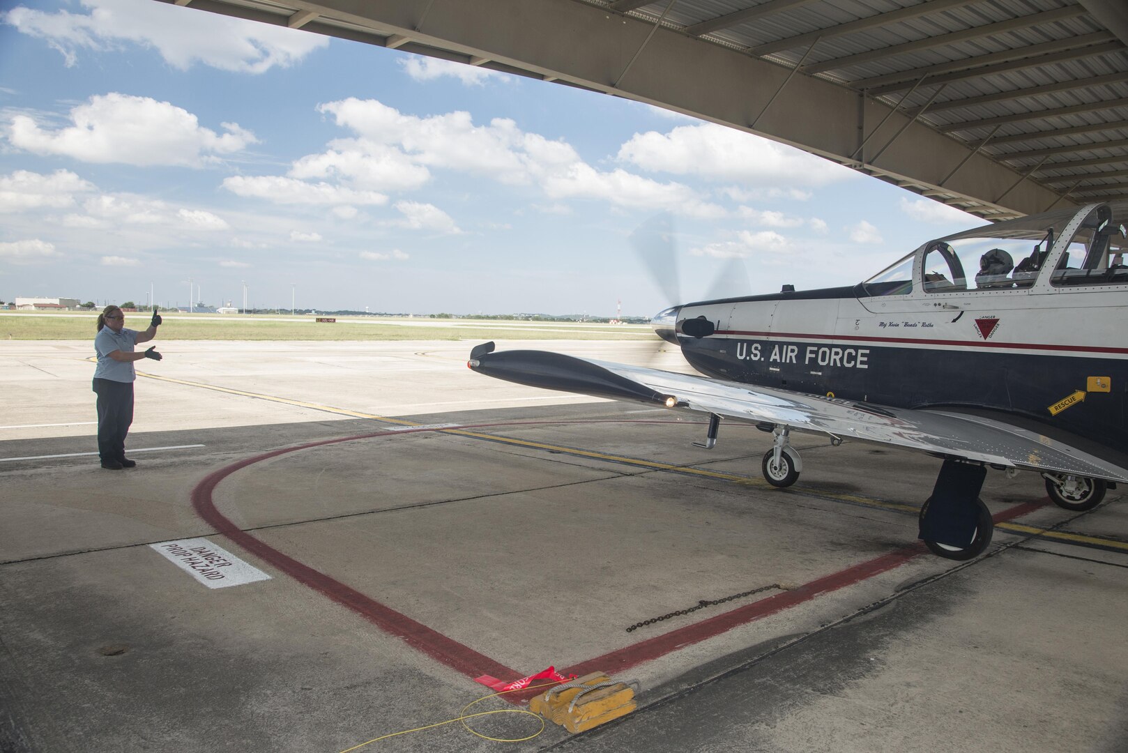 Nicole Goss, 12th Flying Training Maintenance Directorate crew chief, launches a T-6 Texan II Sept. 24, 2015, at Joint Base San Antonio-Randolph. Since she started in the 12th Flying Training Wing Maintenance Directorate at Joint Base San Antonio-Randolph 12 years ago, Nicole Goss has worked her way from intern to crew chief.