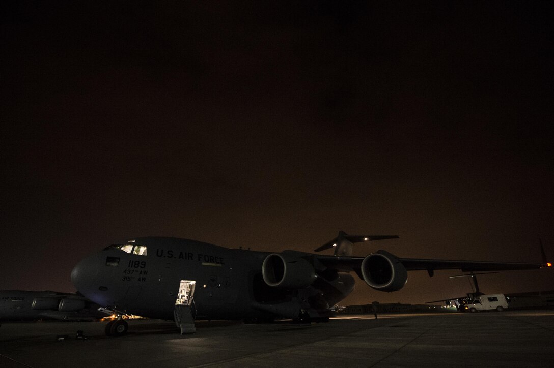 A U.S. Air Force C-17 Globemaster III sits on the flightline at Al Udeid Air Base, Qatar, Jan. 13, 2016. The C-17 crew is assigned to the 816th Expeditionary Airlift Squadron, which is responsible for providing strategic airlift and combat operations support to the U.S. Air Forces Central Command’s area of responsibility. U.S. Air Force photo by Staff Sgt. Corey Hook