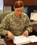 Pennsylvania Air National Guard member Air Force 1st Lt. Hilary Styer, the 111th Attack Wing’s full-time staff judge advocate, prepares her workspace upon taking on her new role at Horsham Air Guard Station, Pennsylvania, Jan. 5, 2016. Styer is a Pennsylvania native who served as a lawyer in the civilian sector before joining the Air National Guard. P