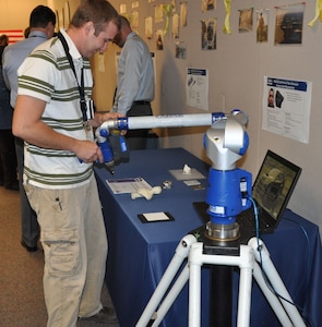 During a recent Print-A-Thon, NSWCDD instrumentation engineer Kevin Streeff demonstrated how the 3D ScanArm is used to scan objects and create digital models for printing. A digital model of the scanned bust is shown on the computer screen during a recent Print-A-Thon. 