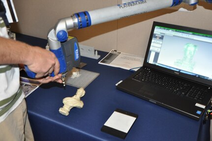 During a recent Print-A-Thon, NSWCDD instrumentation engineer Kevin Streeff demonstrated how the 3D ScanArm is used to scan objects and create digital models for printing. A digital model of the scanned bust is shown on the computer screen during a recent Print-A-Thon.